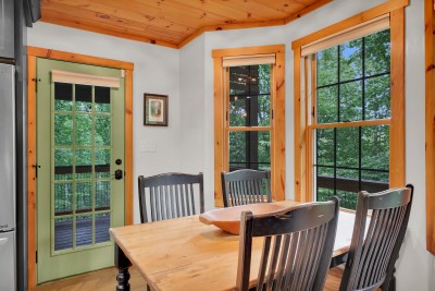 Breakfast in the corner nook with windows on two sides, then out the green door to the deck when the coffee is gone.