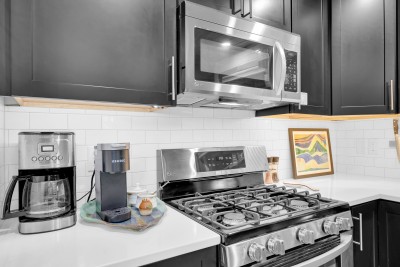 Gas range, drip coffee maker, and a Keurig for whoever is up first. Start the kettle and take it out to the porch.