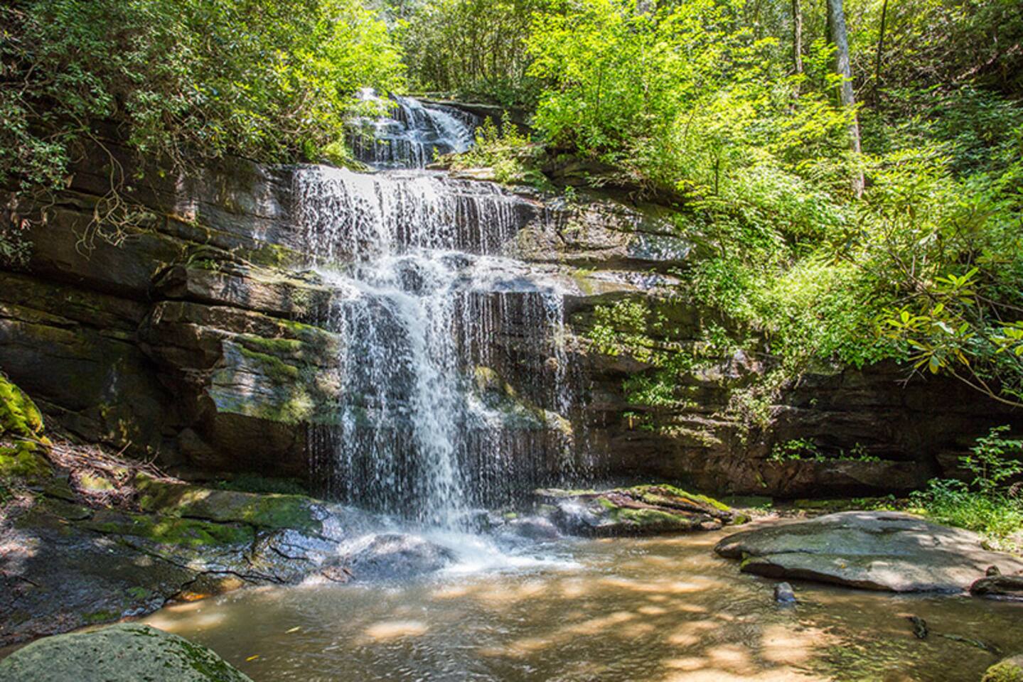 Cool off in the pool beneath the waterfall, dogs love it and there is even a hidden alcove behind the falling water.