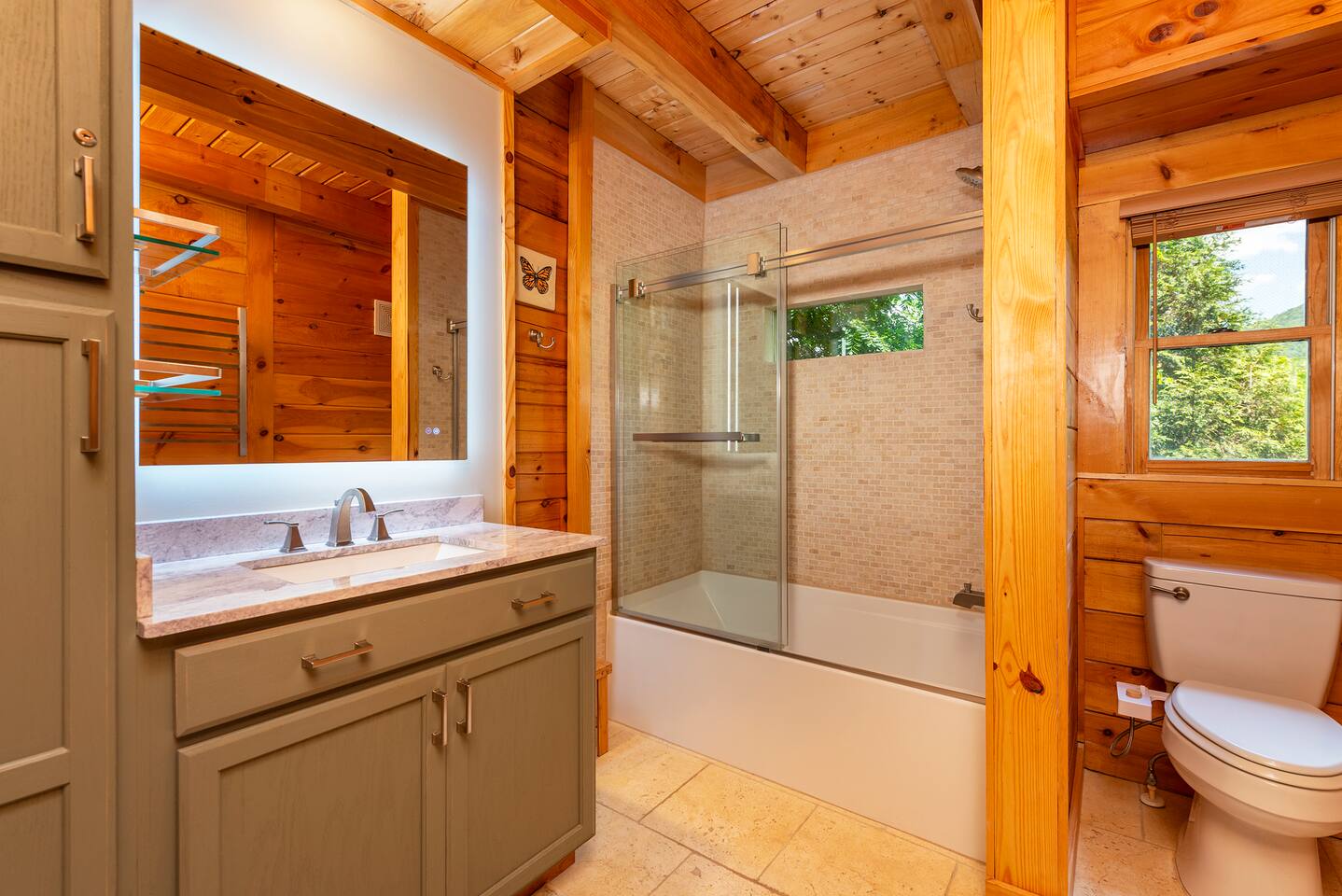 Beautiful views of the Blue Ridge Mountains while showering in the main bathroom.