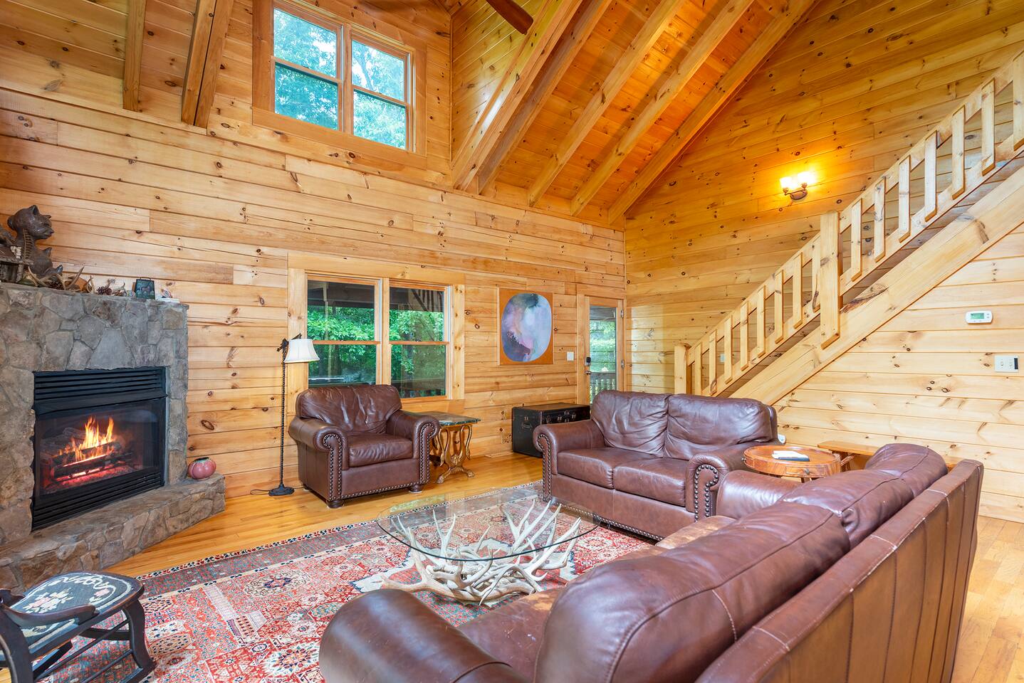 Gather together in this generous living room on your family getaway in the Blue Ridge Mountains, plenty of room for all!  In this pet friendly cabin, your animals will also enjoy the fireplace.