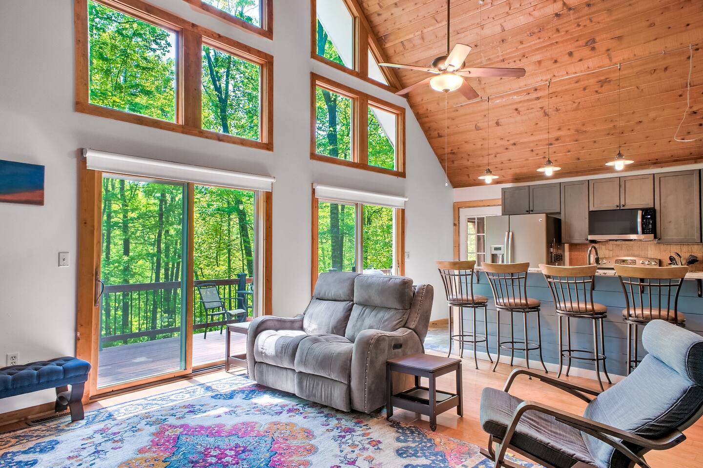 Gather together in this open living room/kitchen space under soaring cathedral ceilings. Enjoy the peace of being in the Blue Ridge Mountains.