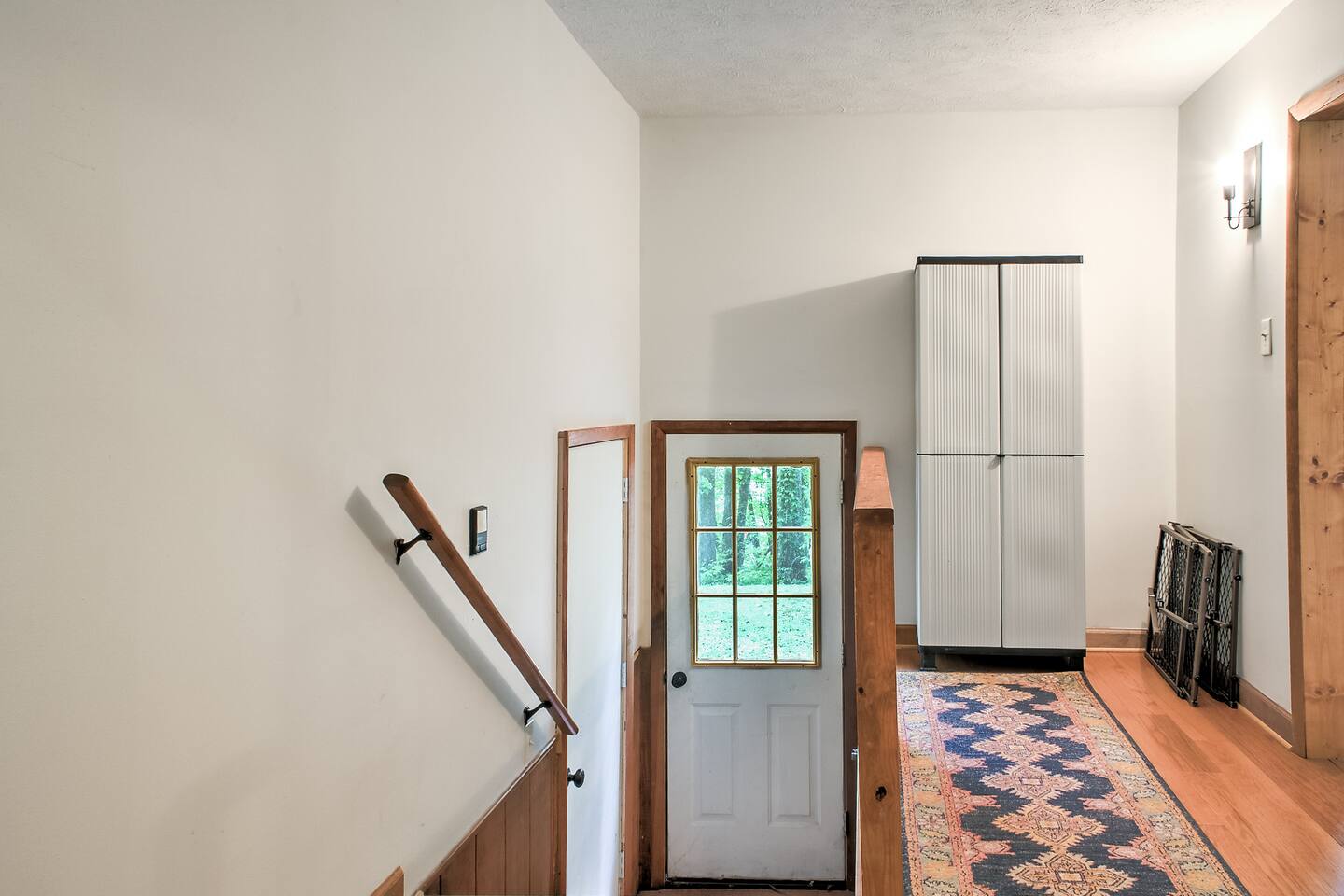 Door to the garage & secondary door to the exterior
