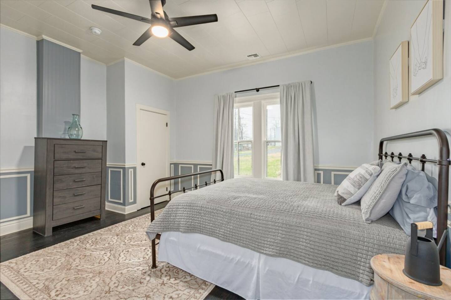 Sheer shades and blackout curtains throughout home.