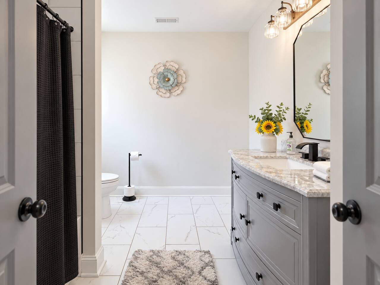 Freshen up in a bright bathroom with a spacious vanity, modern fixtures, and plenty of natural light.