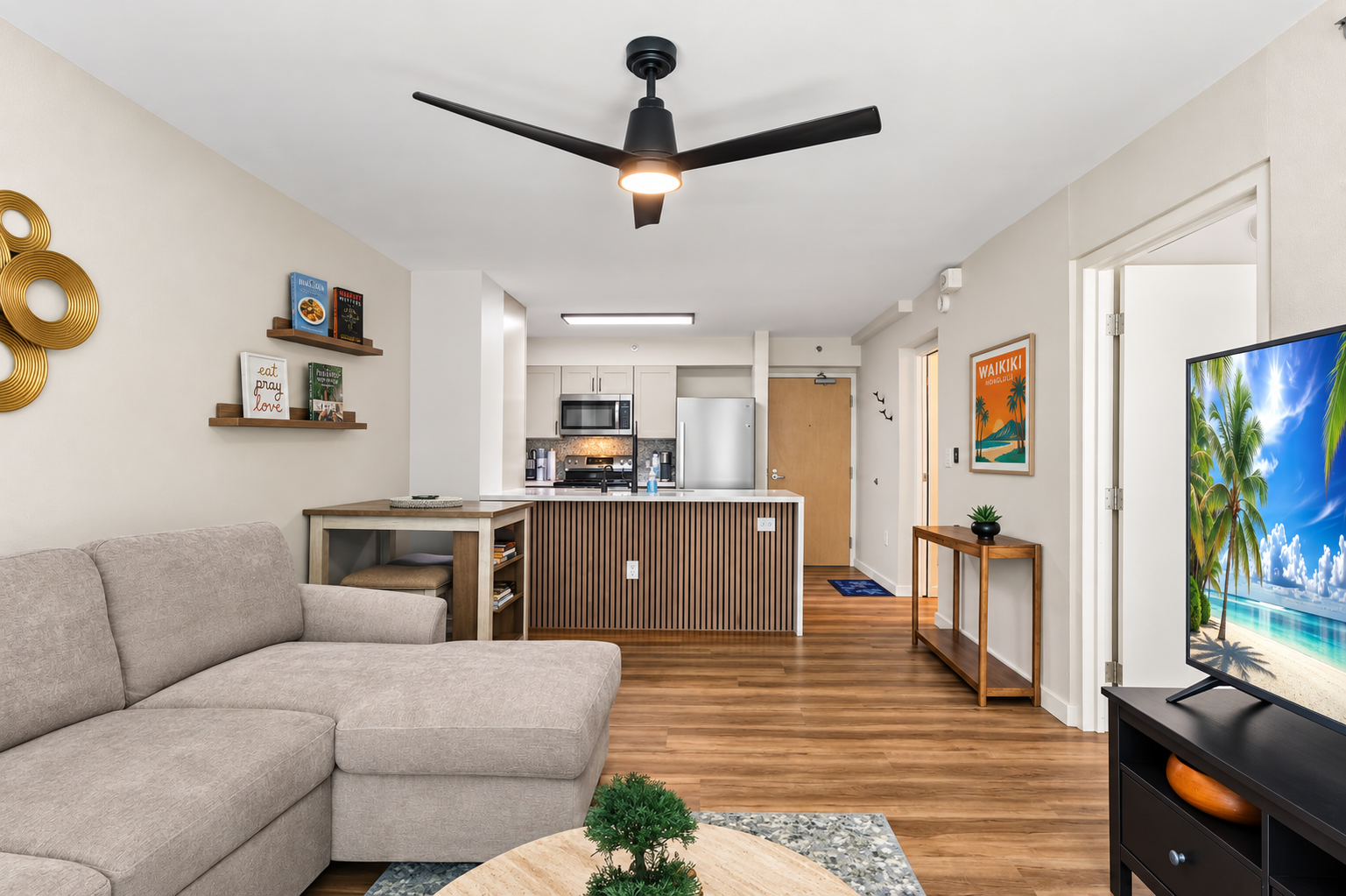 Bright open living space with full kitchen, bar seating, and island-style vibes