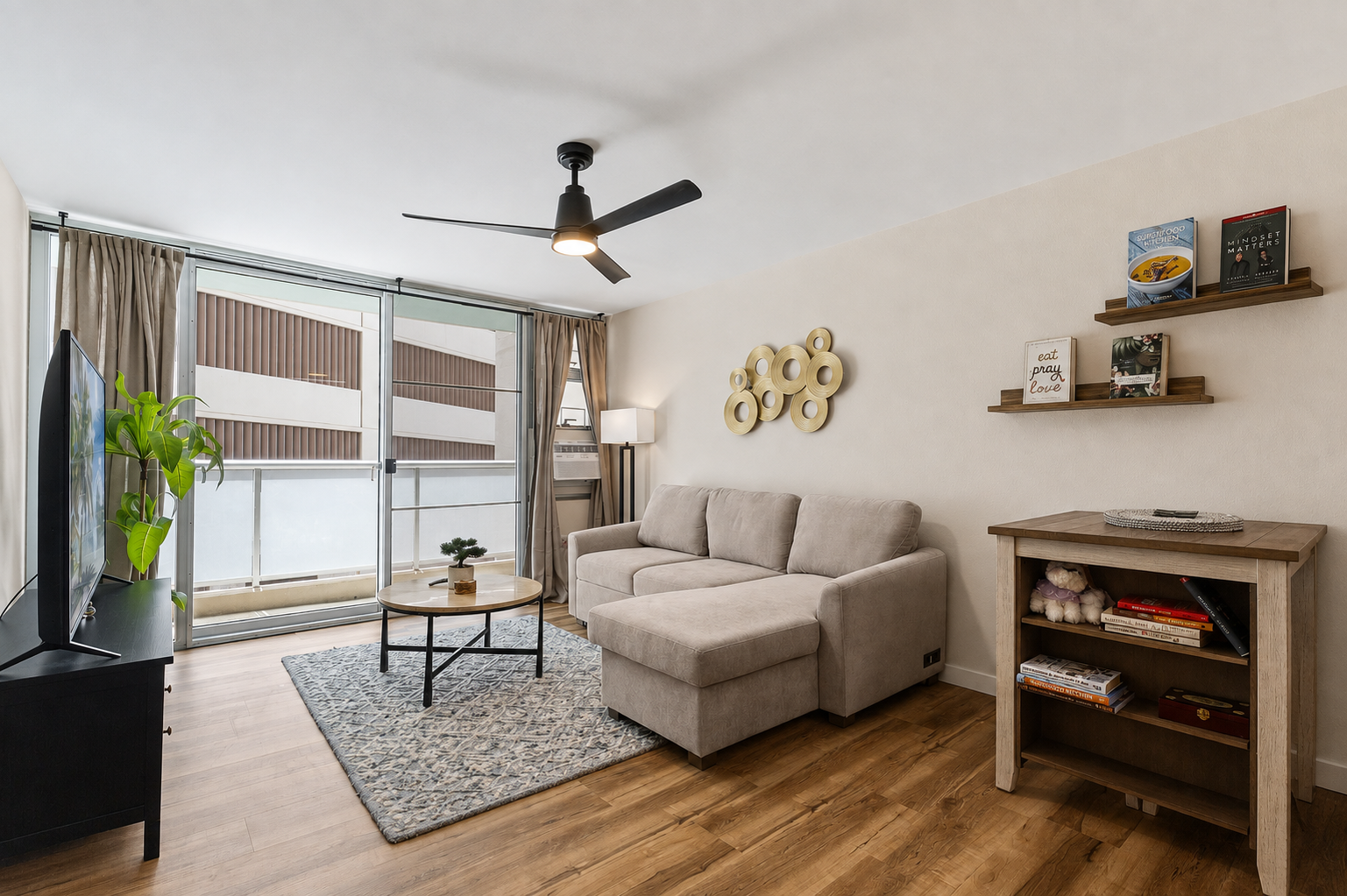 Bright modern lounge with cozy sectional and private balcony access
