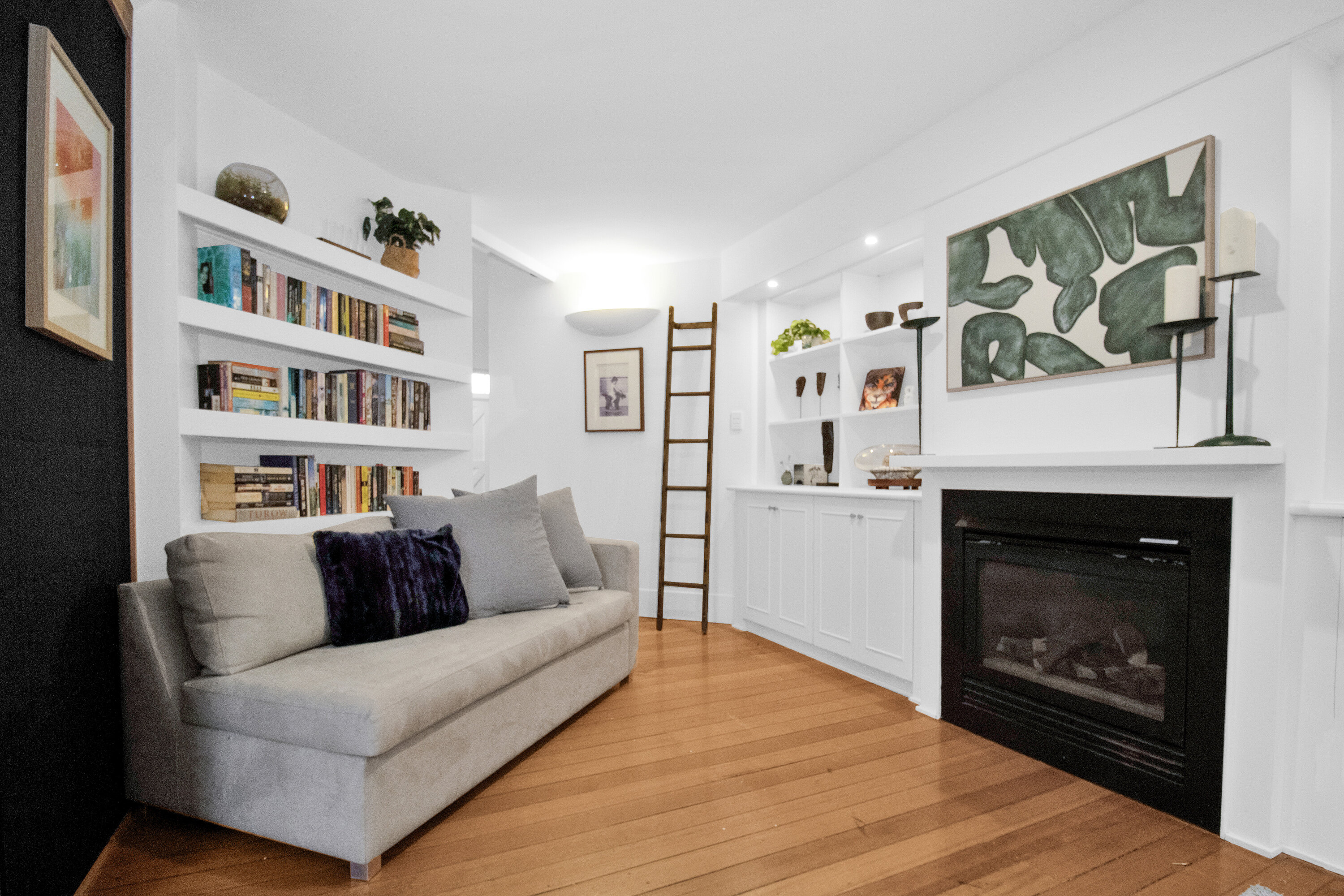 Cozy reading nook with fireplace, built-ins, and warm modern style