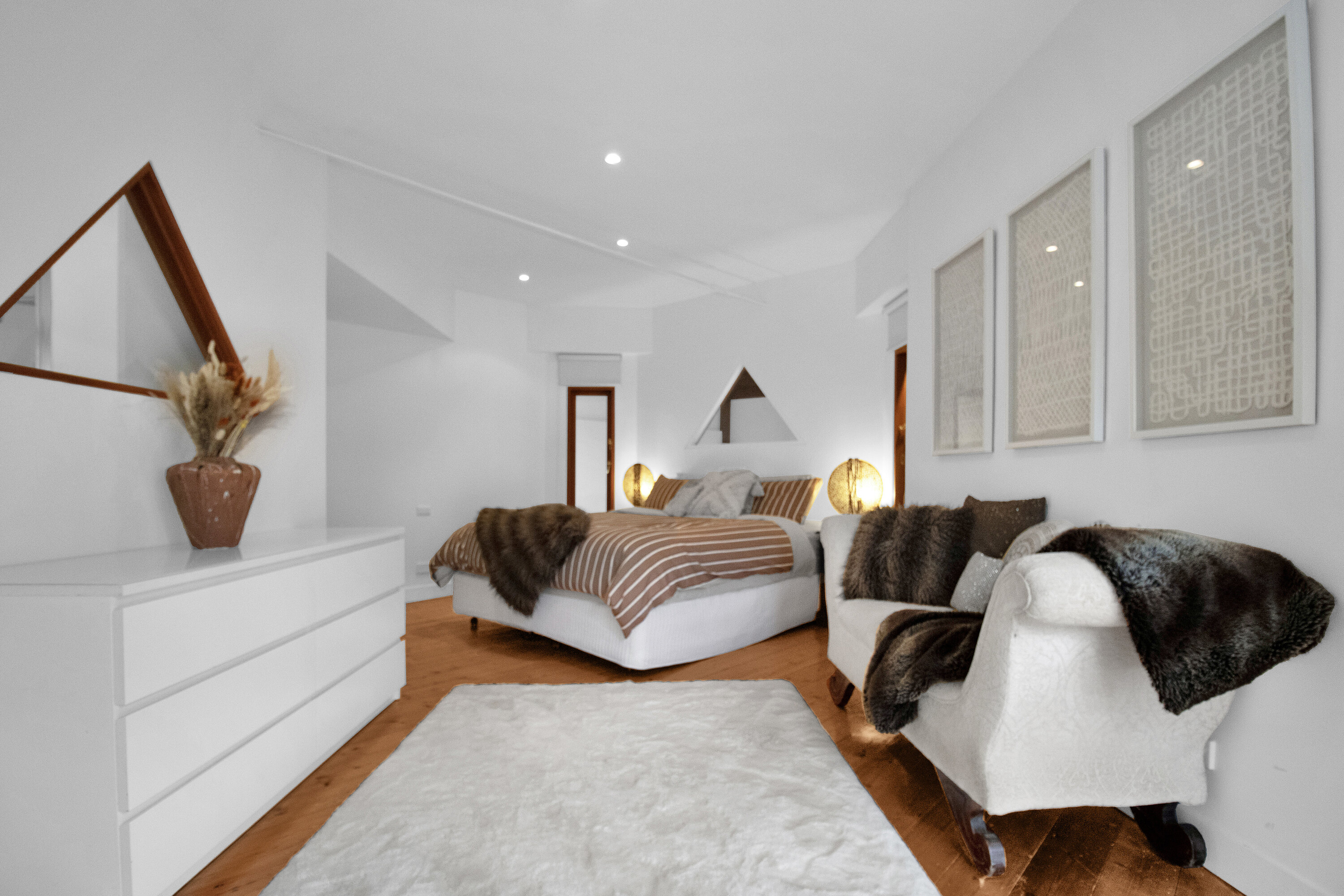 Bright, cozy bedroom retreat with plush textures and modern styling
