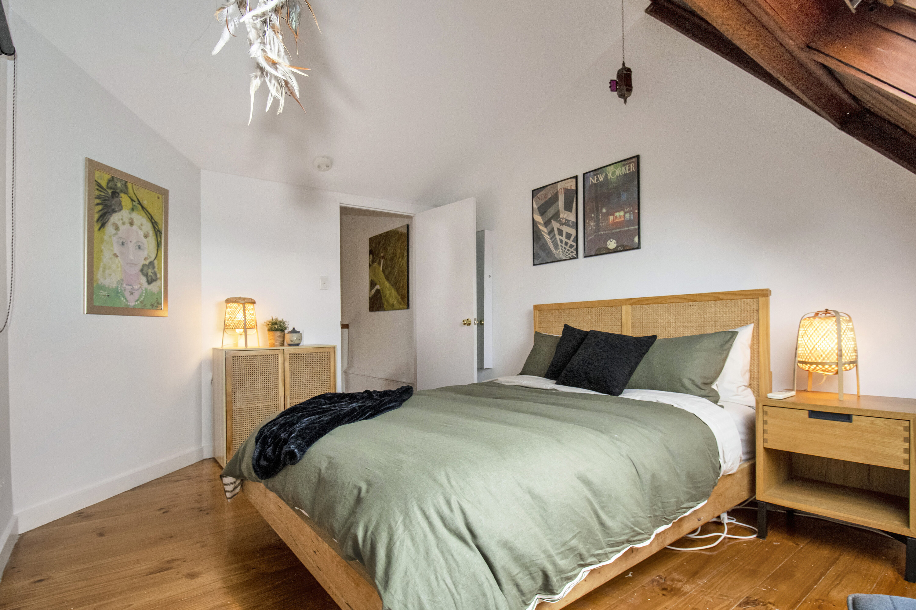 Cozy loft-style bedroom with warm wood accents and soft natural light