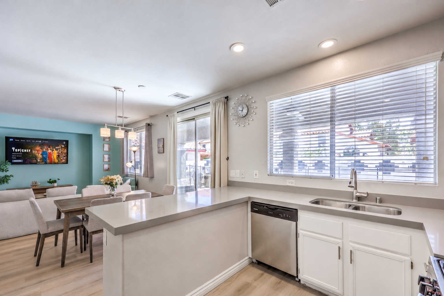 Bright open kitchen and dining area with easy patio access