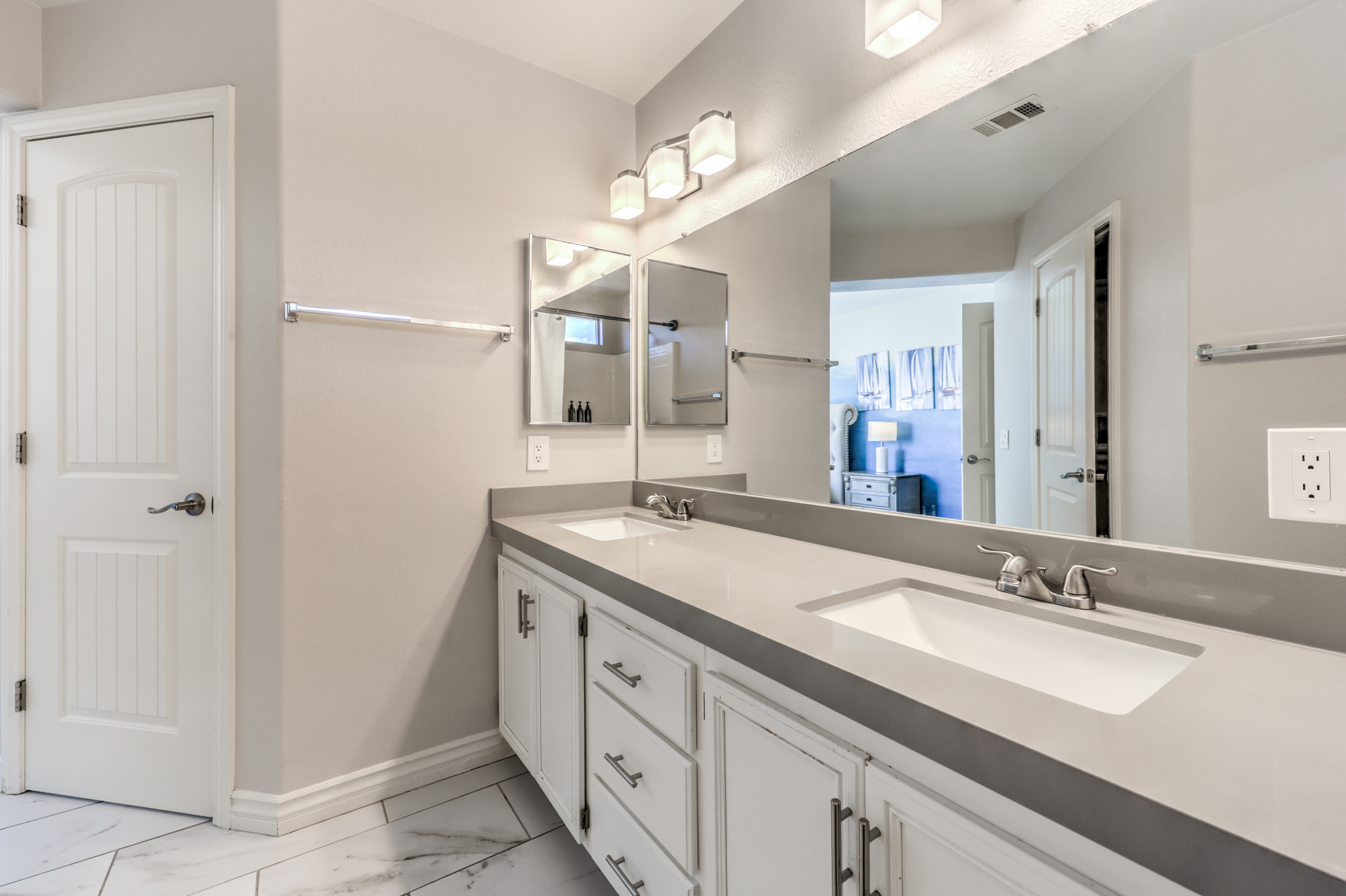 Bright double-vanity bathroom with modern finishes and ample space