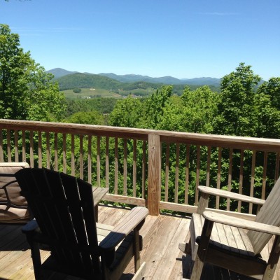 Private mountain-view deck with Adirondack seating and scenic vistas