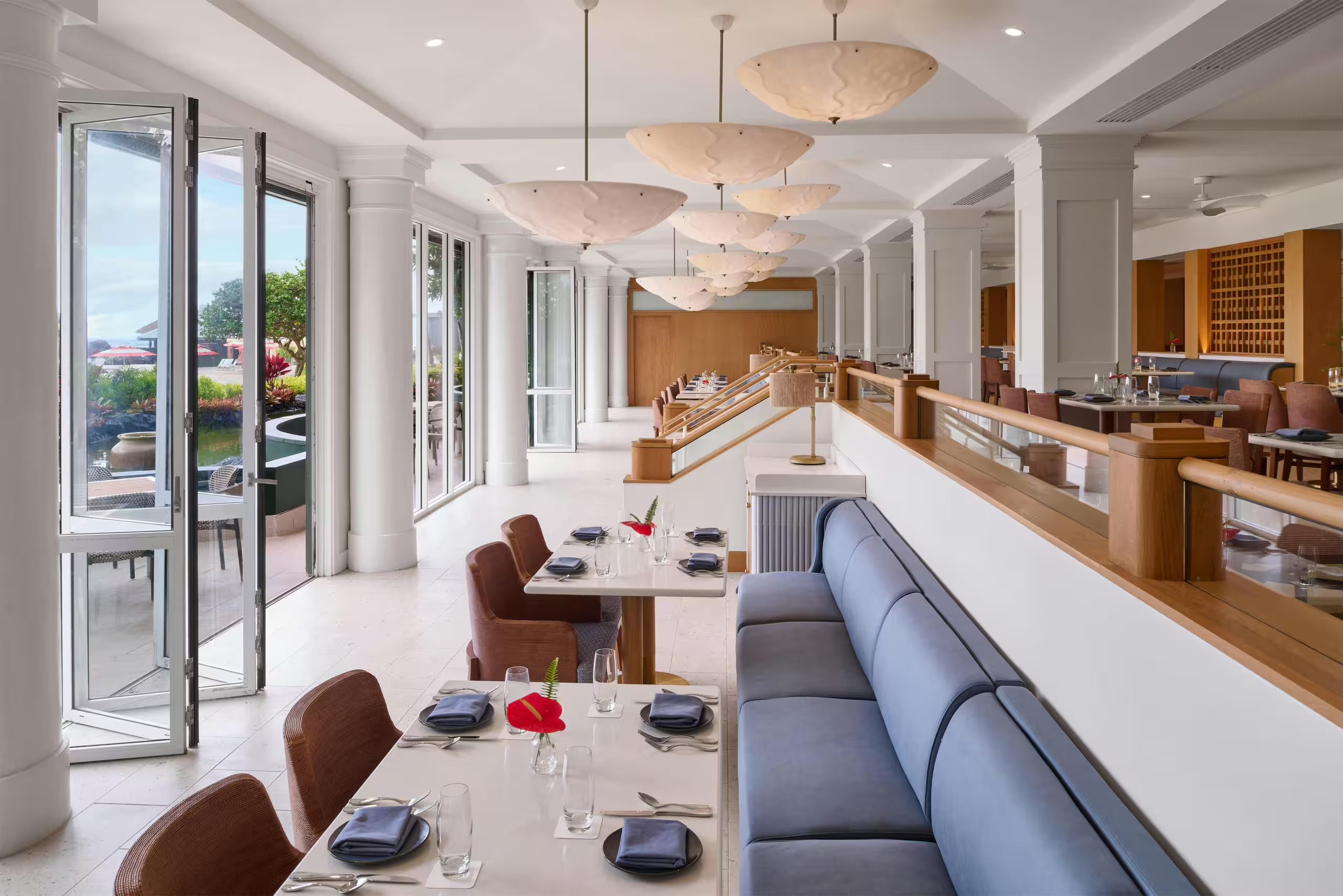 Bright, elegant dining room with terrace access and stylish seating at Ocean House by Roy Yamaguchi