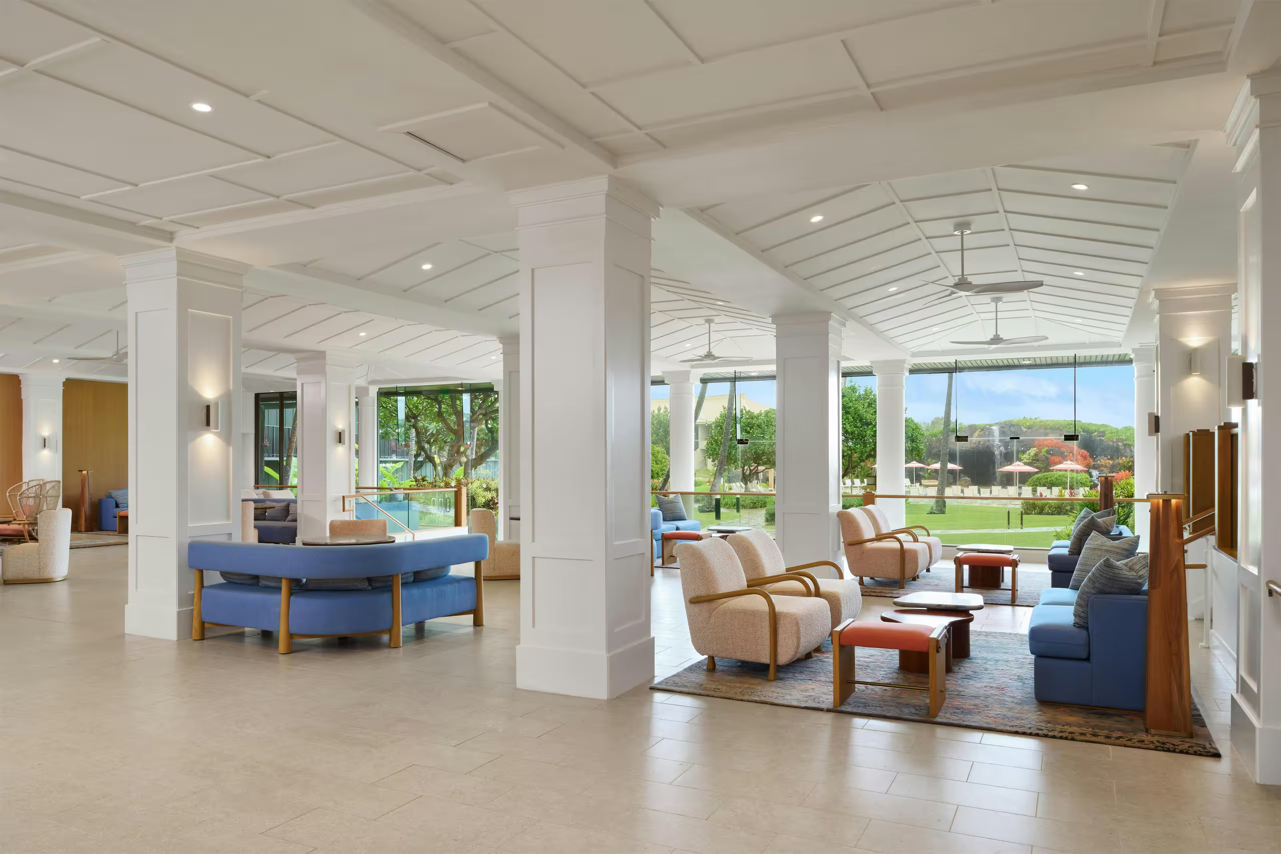 Bright, elegant lounge with stylish seating and garden views