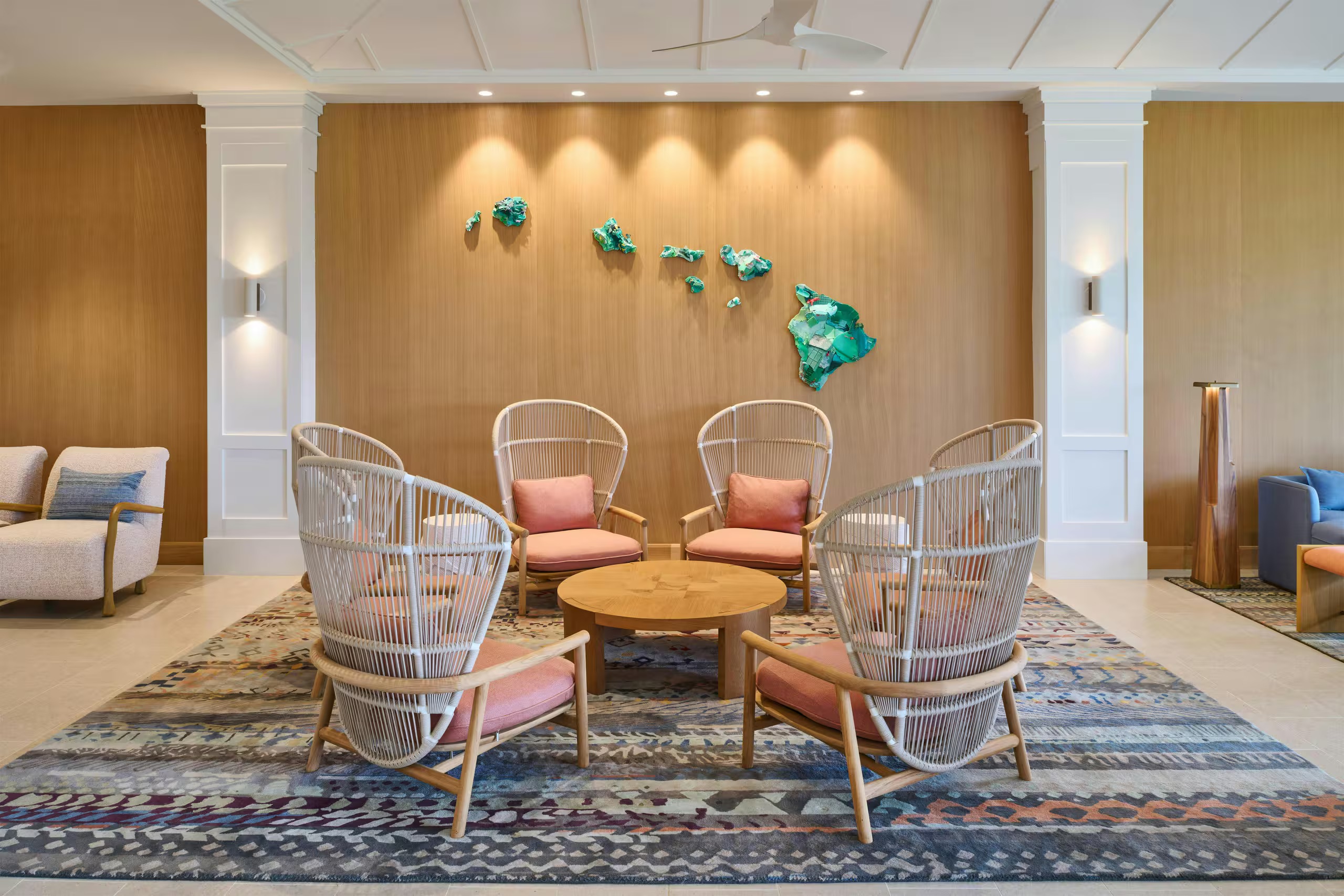 Inviting designer lobby with island-inspired art and cozy lounge seating