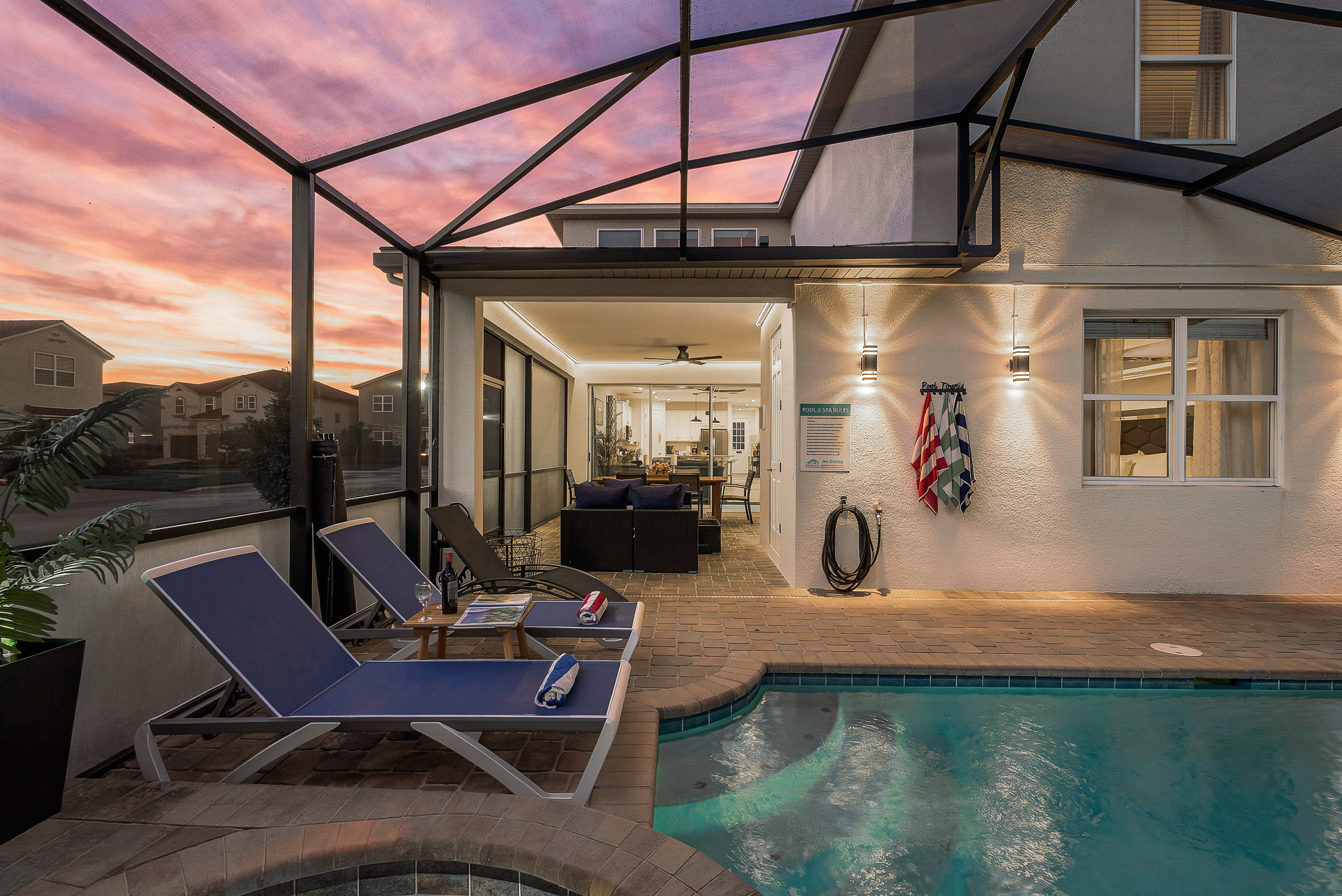 Private screened pool & spa with sunset views and stylish lounge seating