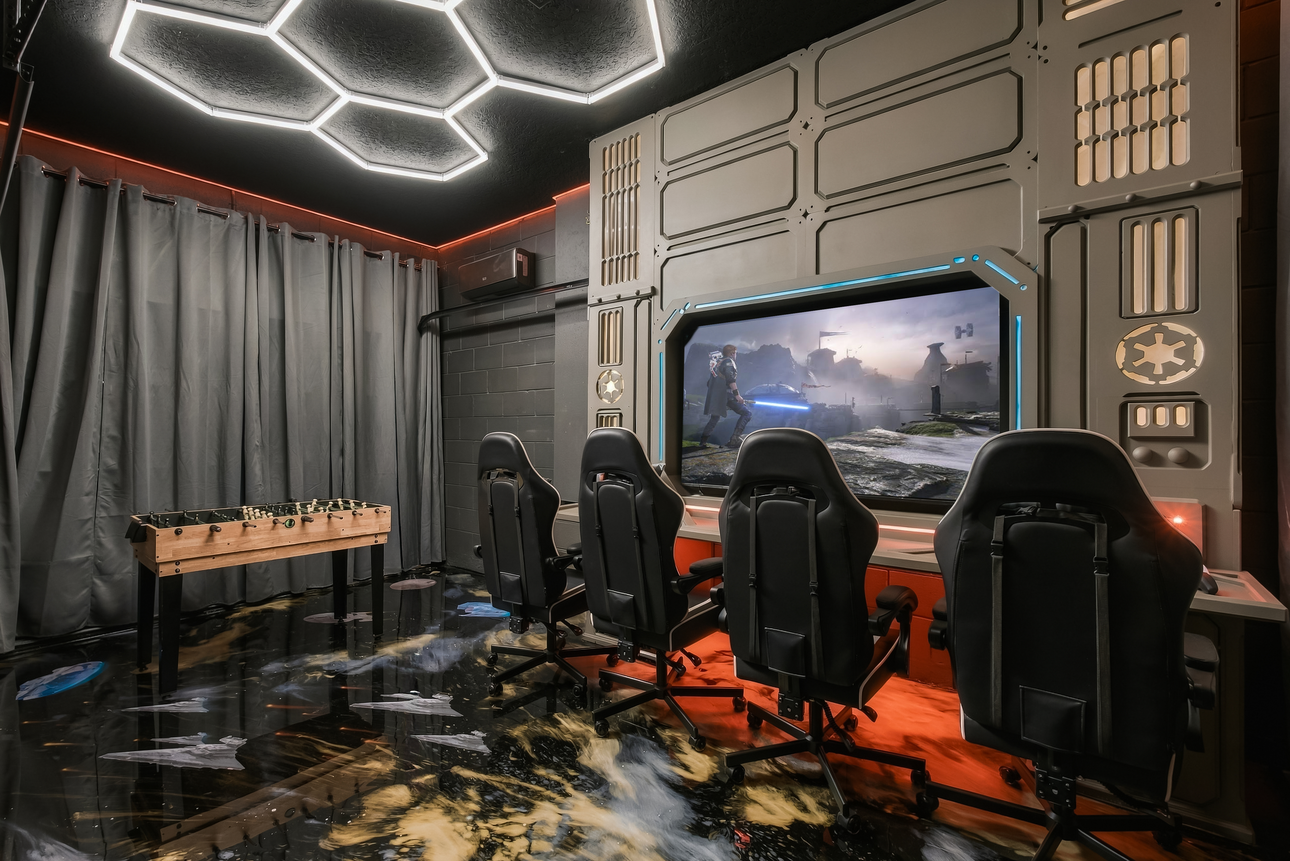 Epic sci-fi game room with 4 gaming chairs, big screen & foosball