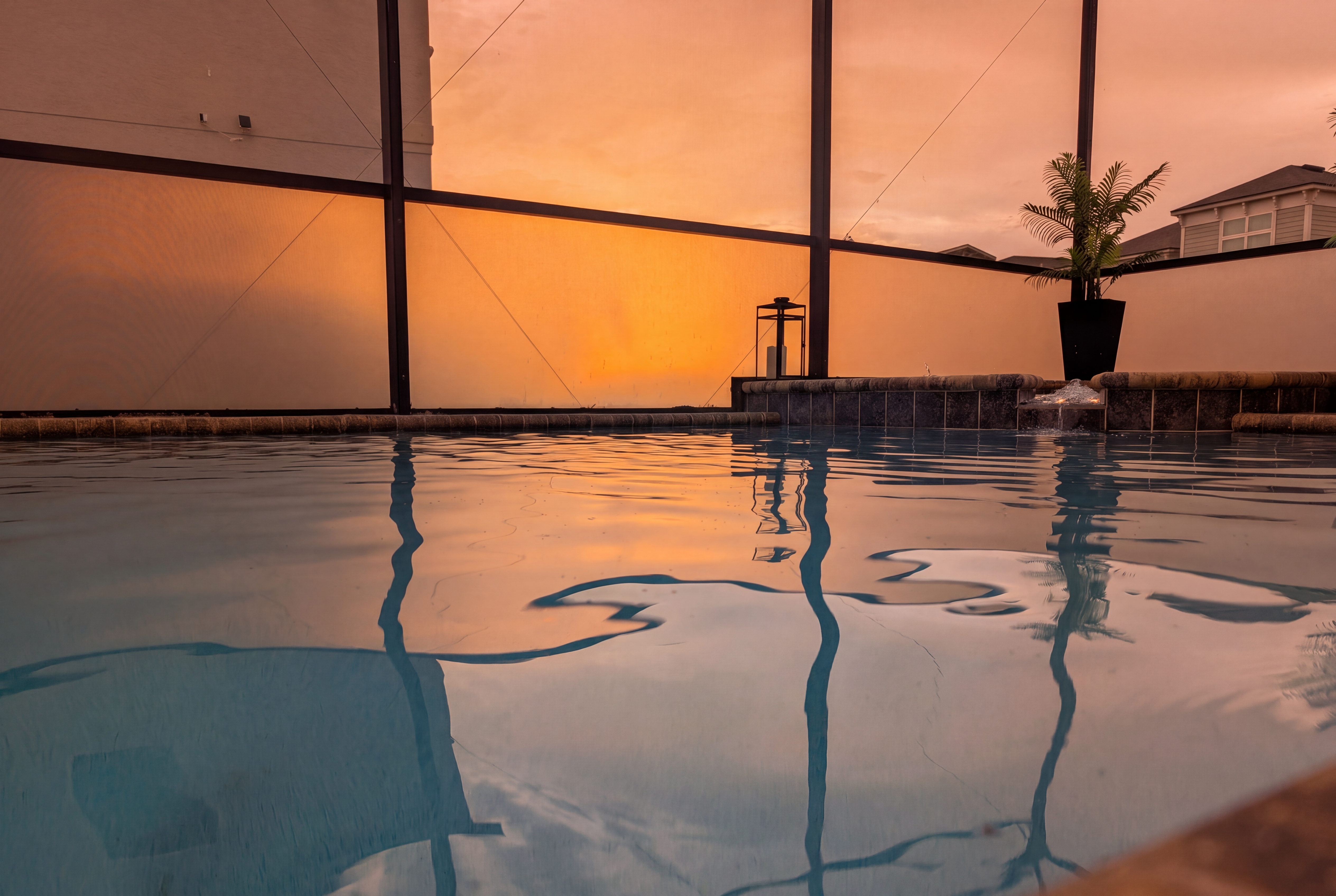 Screened-in private pool with stunning sunset views