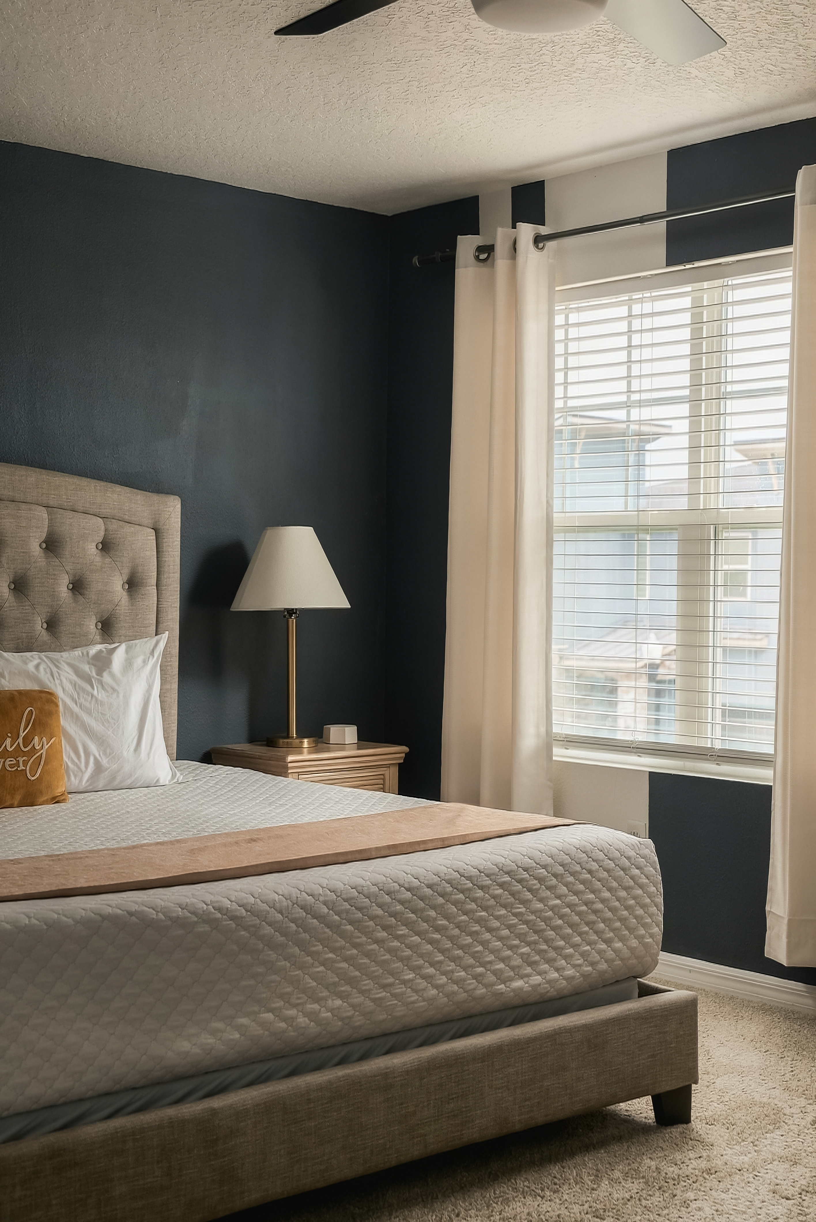 Cozy, light-filled bedroom with stylish accents and plush comfort