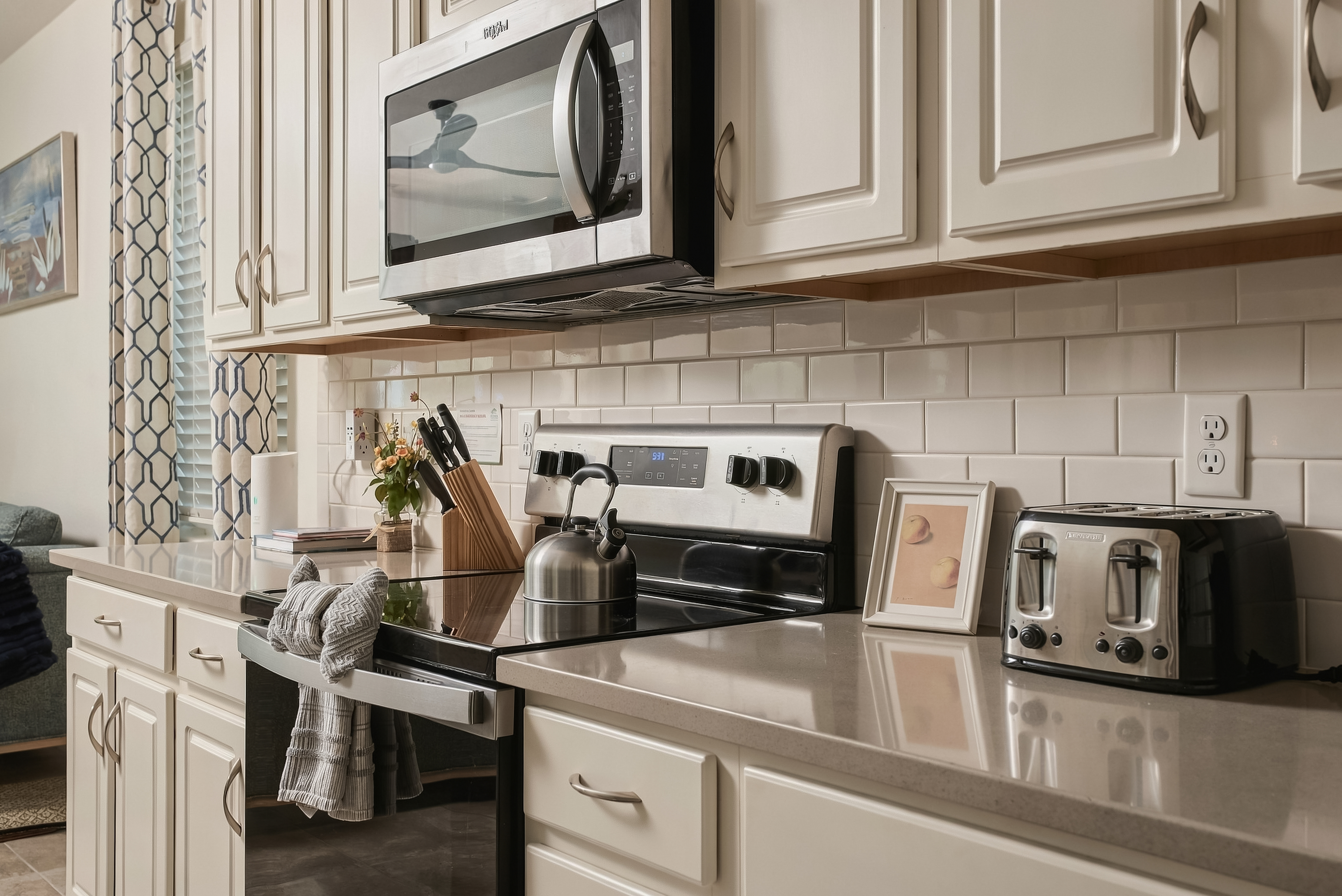 Bright modern kitchen with stainless appliances and stylish finishes