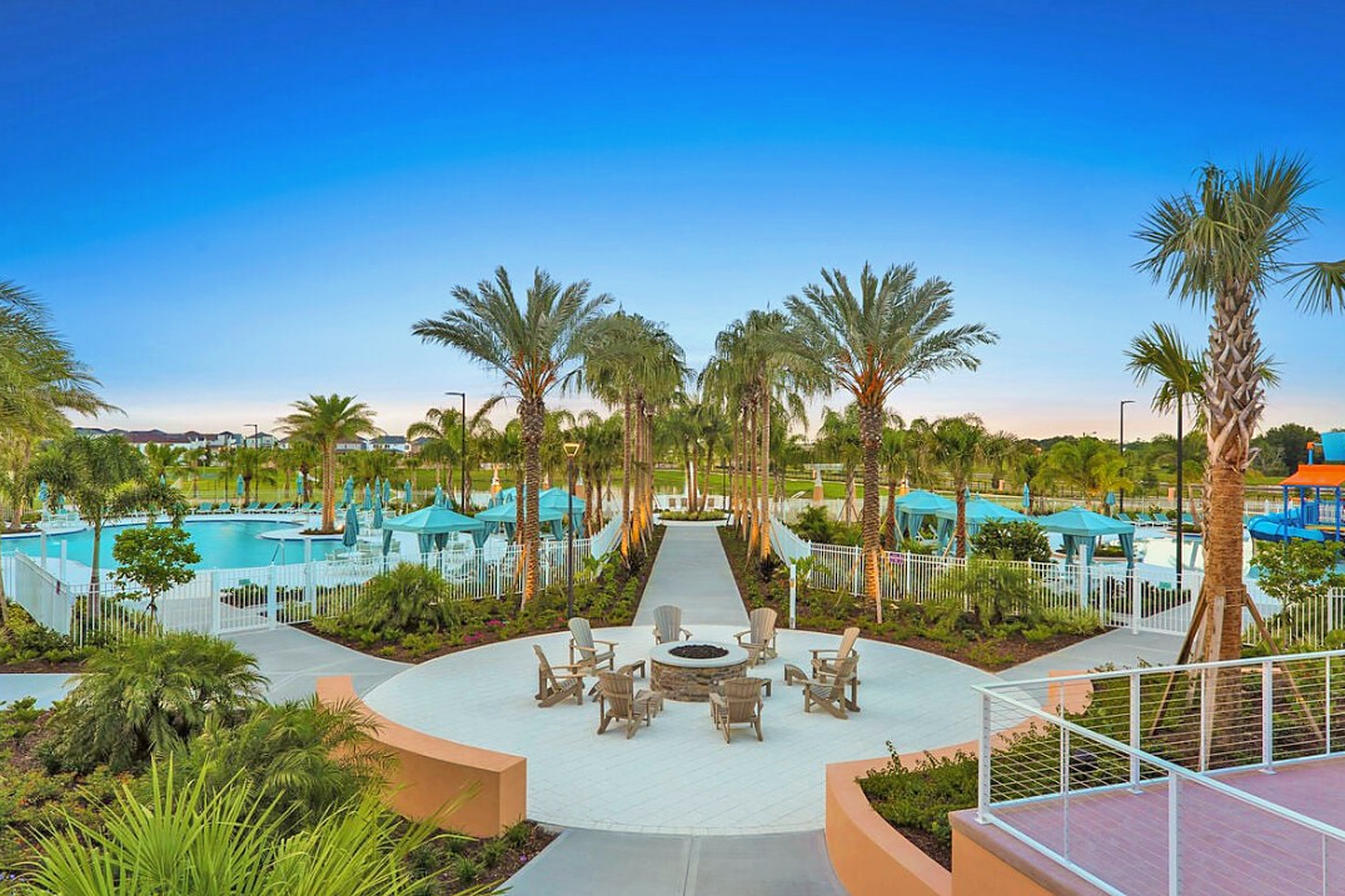 Resort-style pools, palm views, and a cozy fire pit lounge