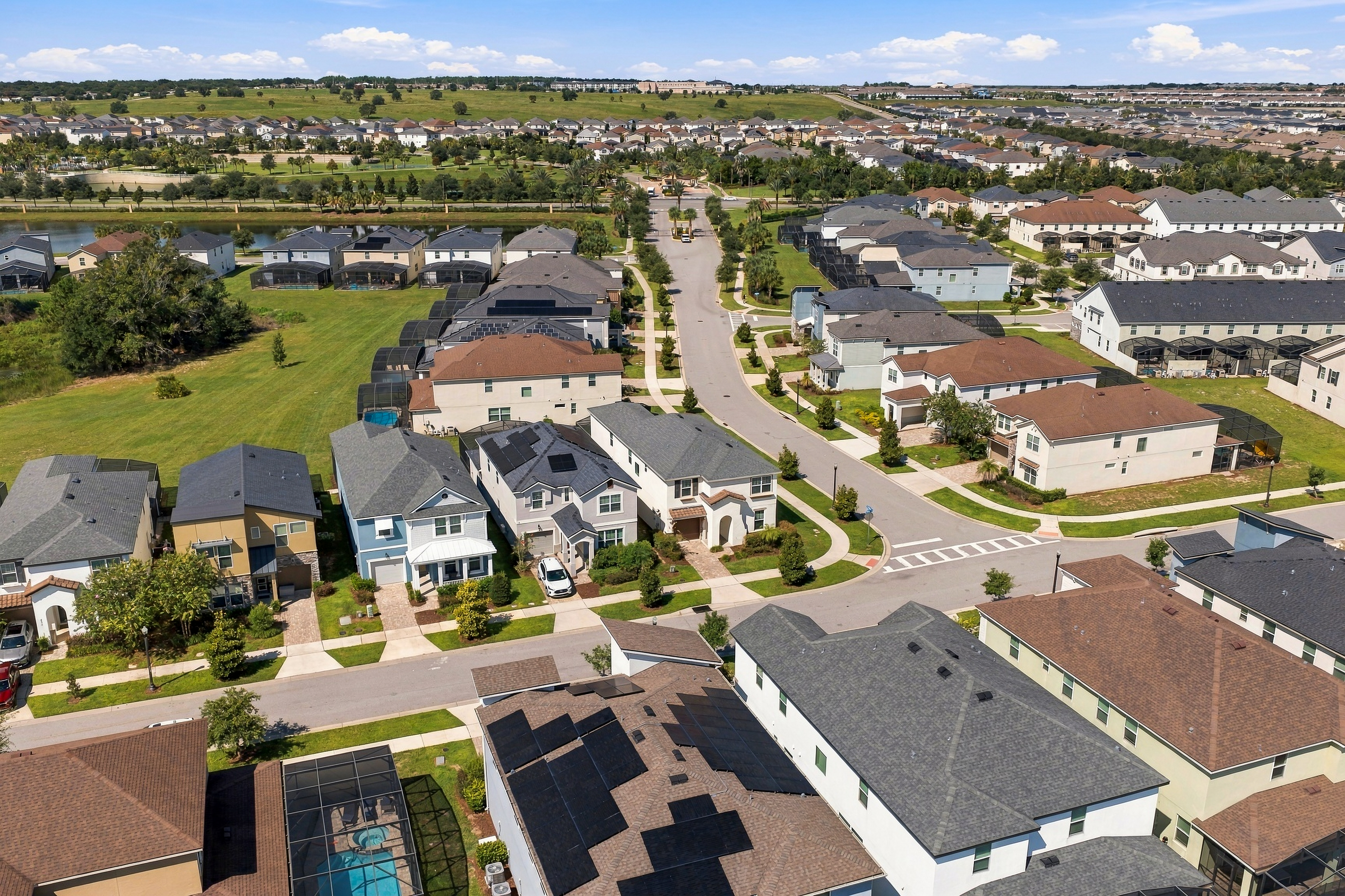 Aerial view of a spacious, modern neighborhood with green space