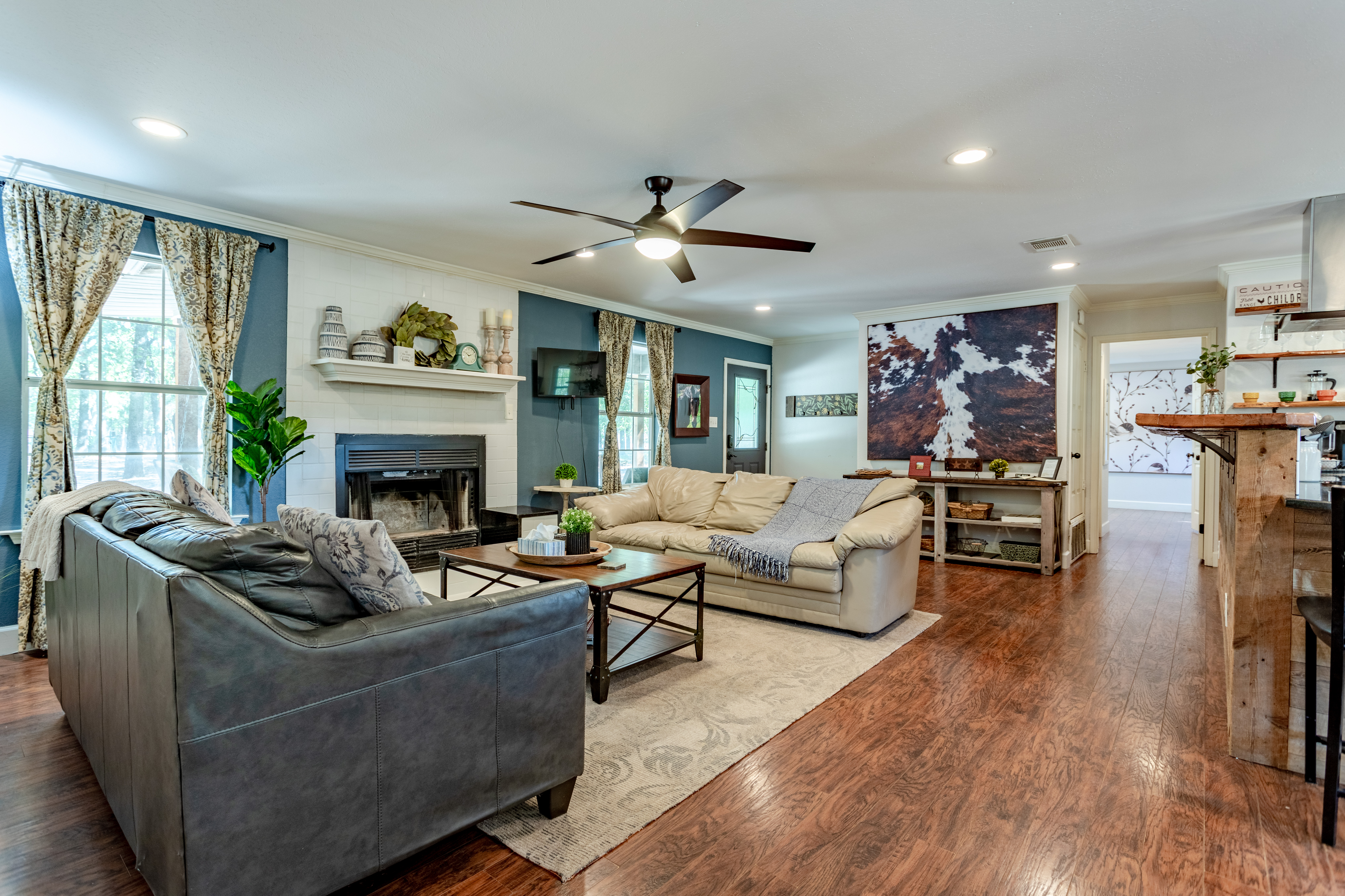 Spacious, cozy living room with fireplace and open-concept charm