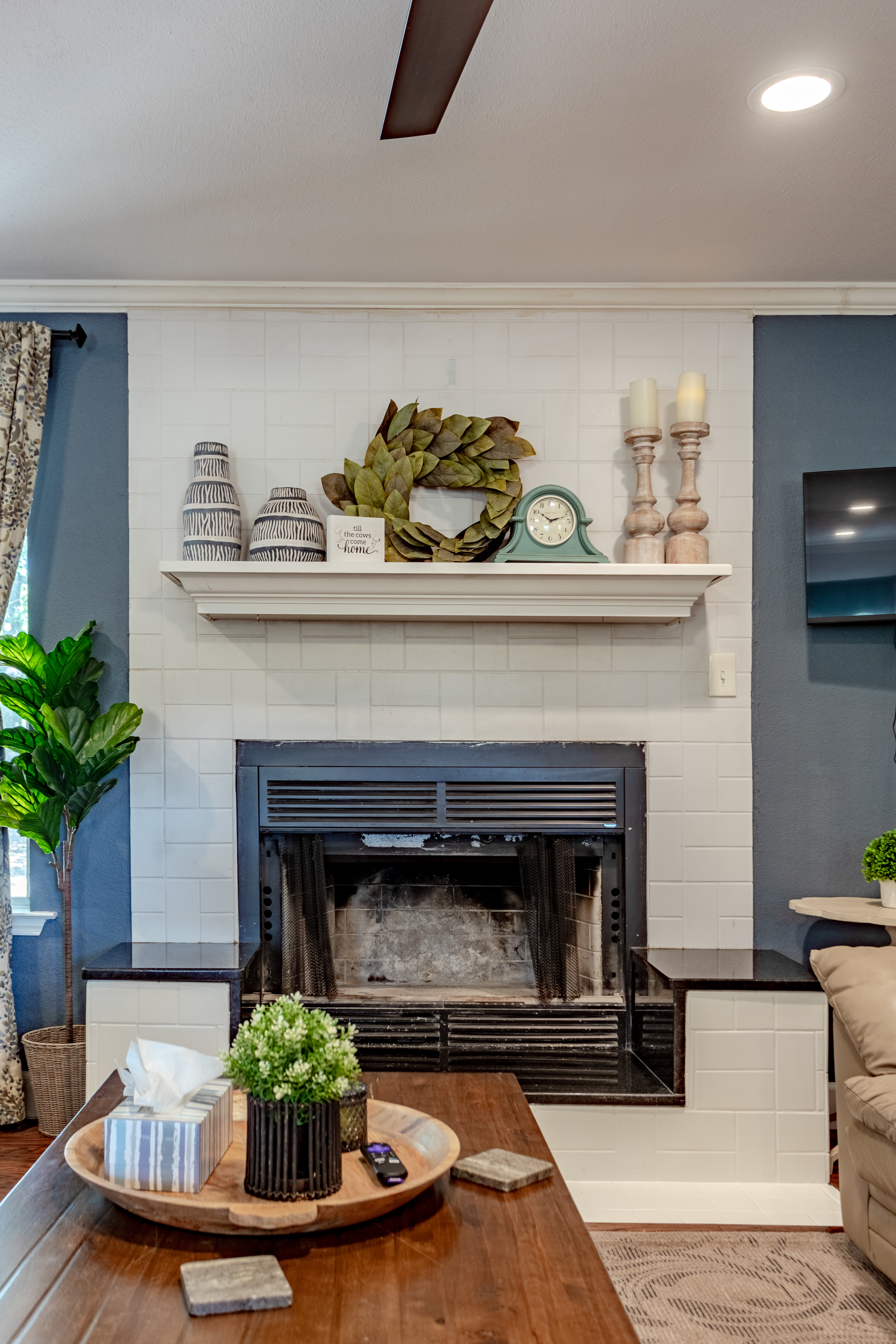 Cozy living room with stylish fireplace and inviting designer touches