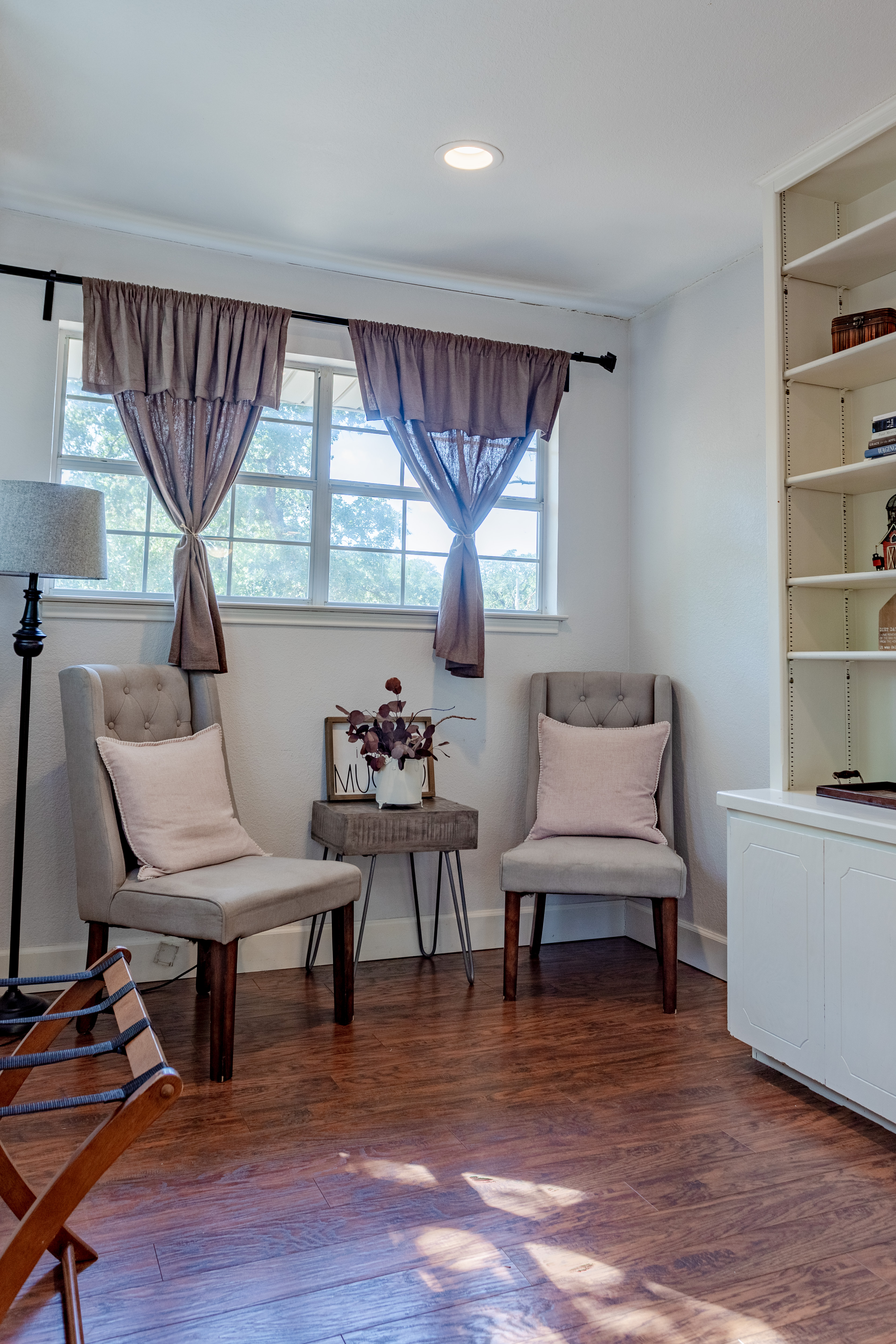 Bright reading nook with built-in shelves and cozy seating