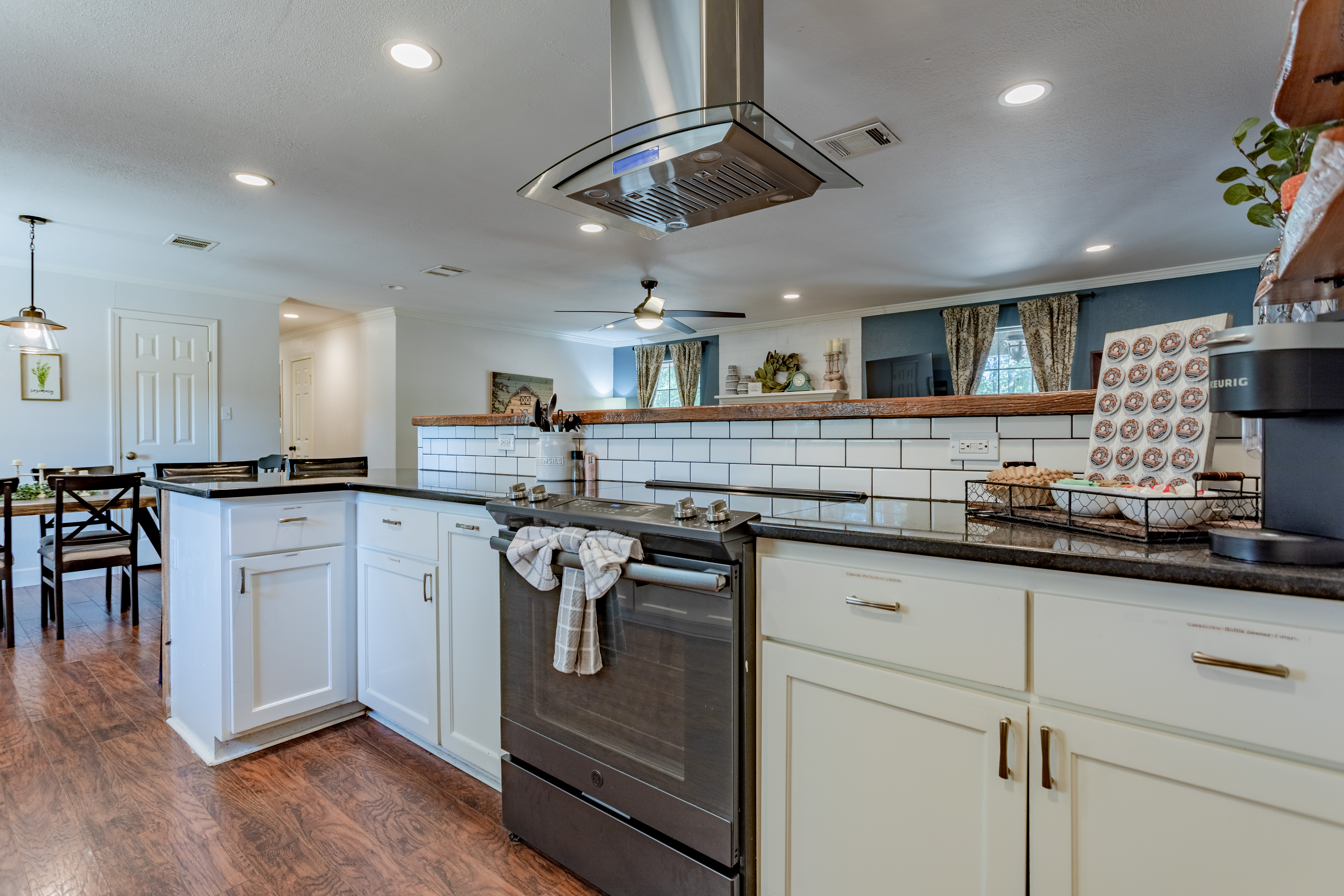 Bright open kitchen with island cooktop and stylish modern finishes