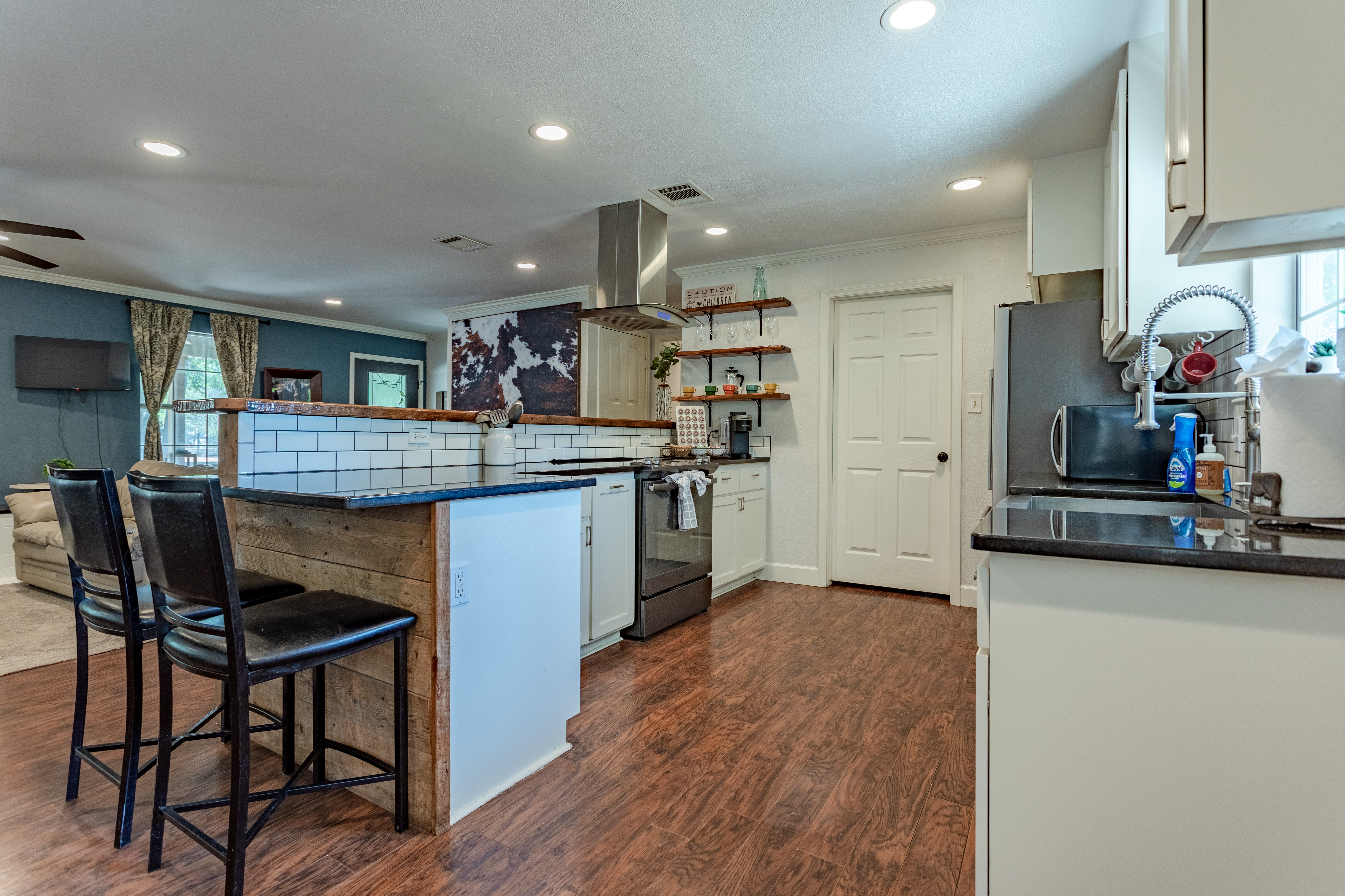 Bright open kitchen with breakfast bar and stylish modern finishes