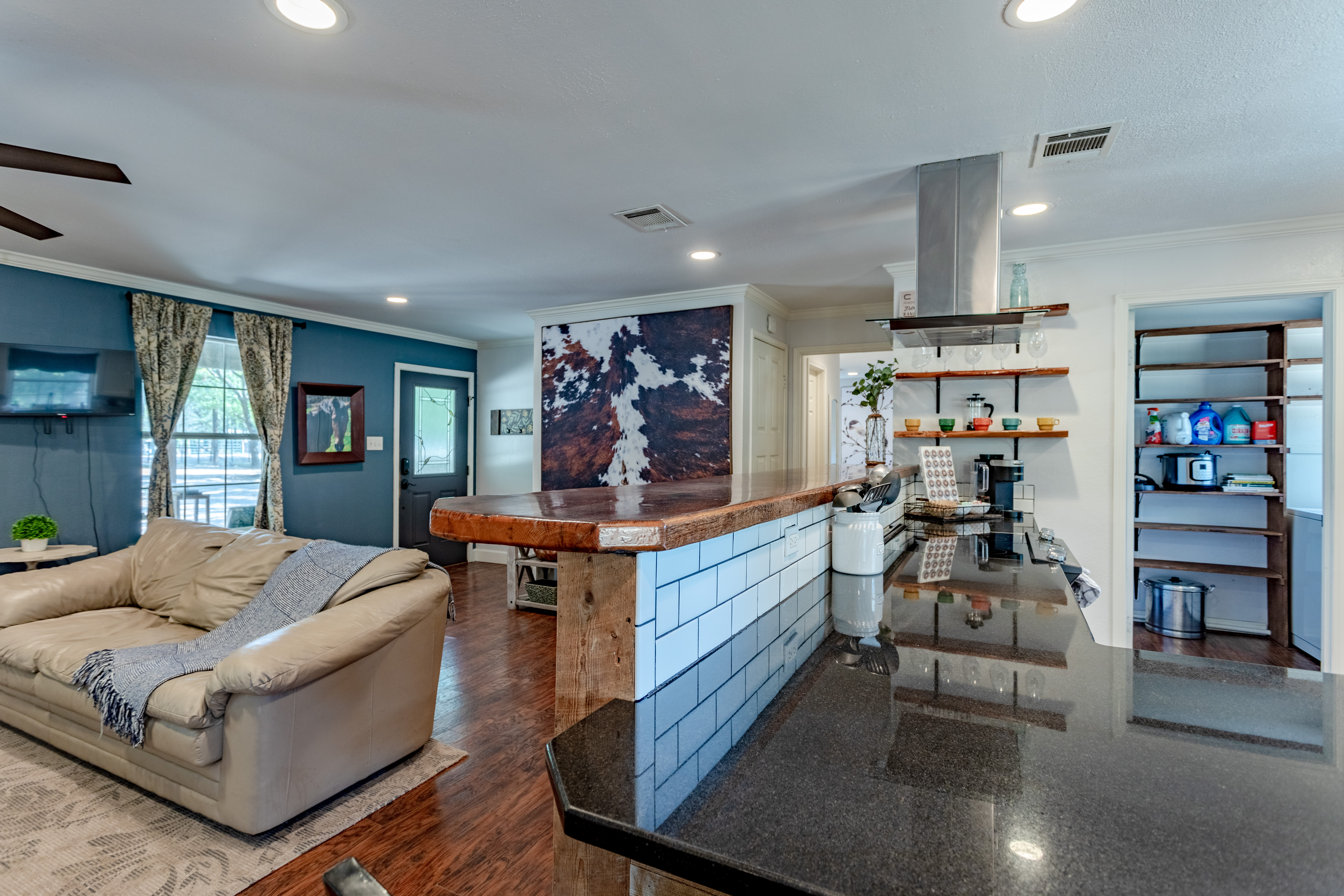 Bright open-concept kitchen and lounge with large island and cozy seating