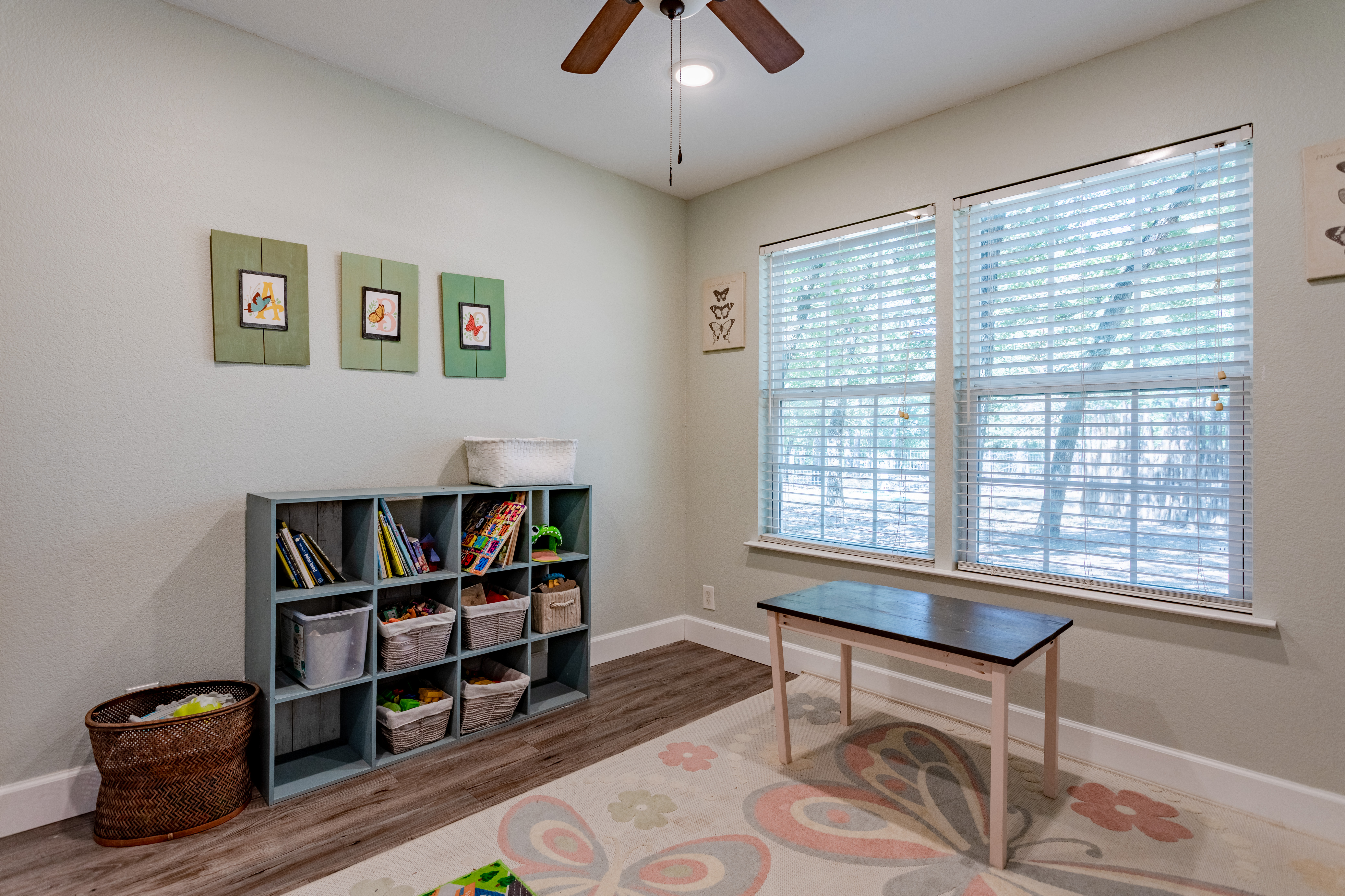 Bright family-friendly playroom with natural light and organized toy storage