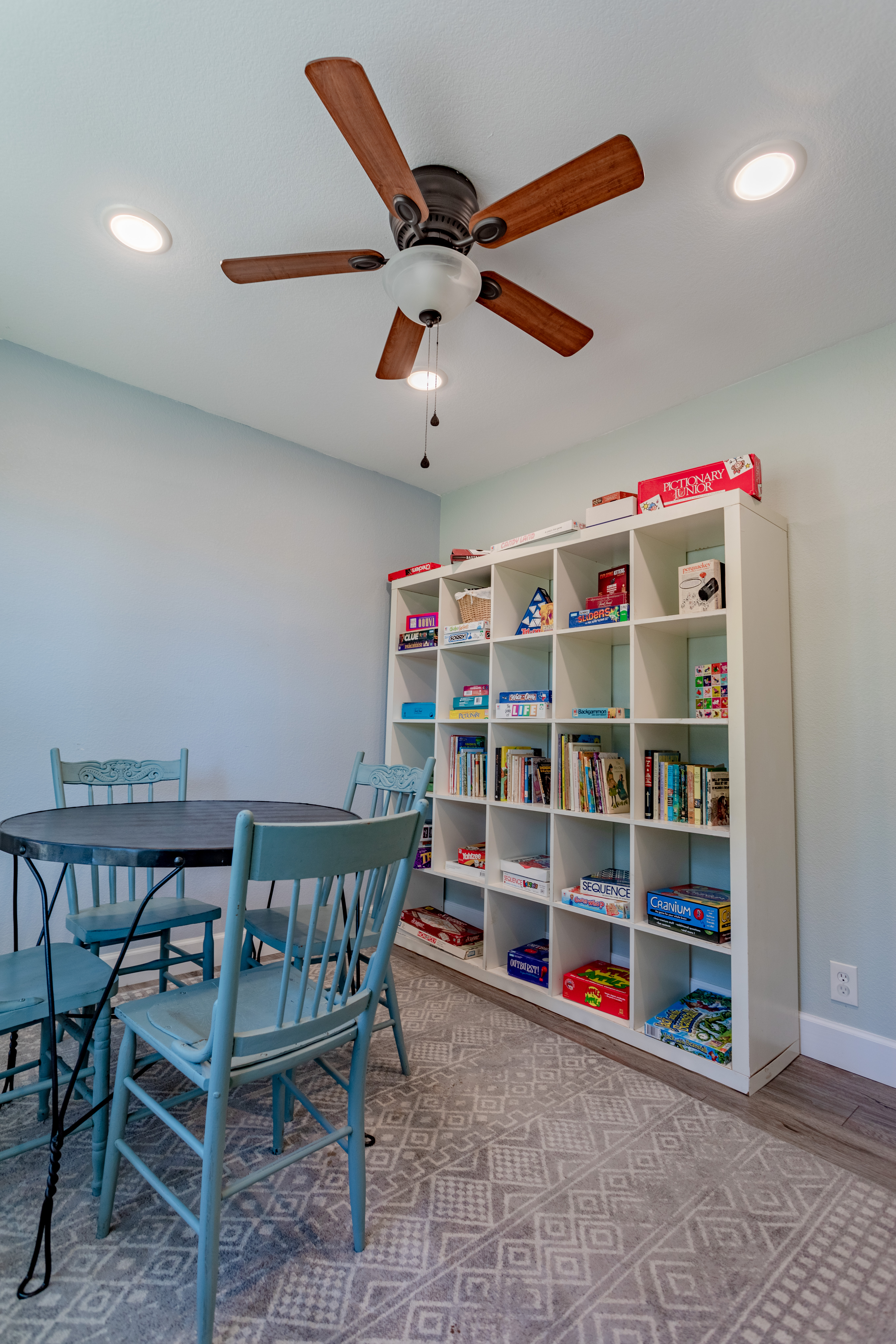Cozy game and reading nook with books, board games, and family seating