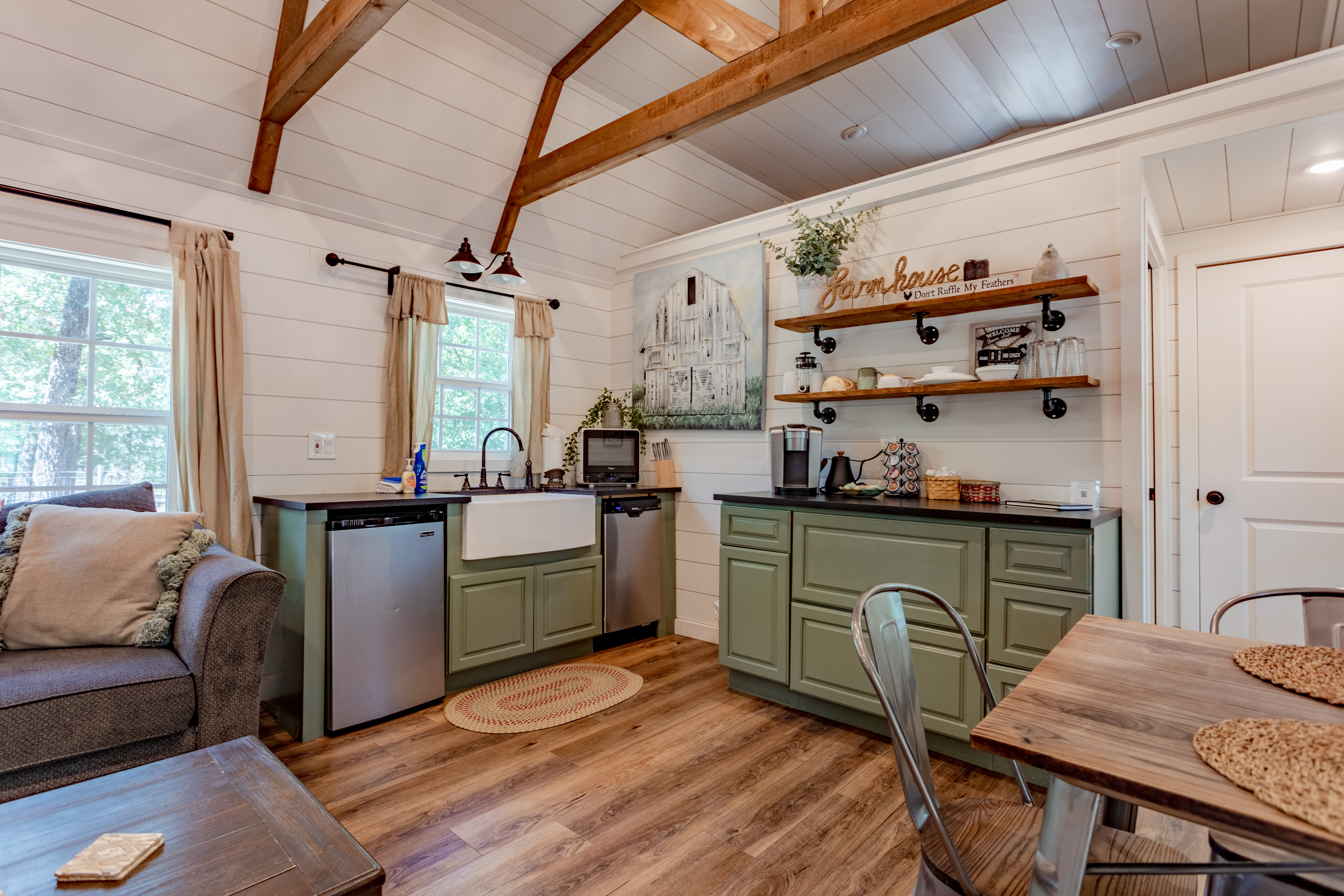 Charming farmhouse kitchen with vaulted ceilings and rustic beams