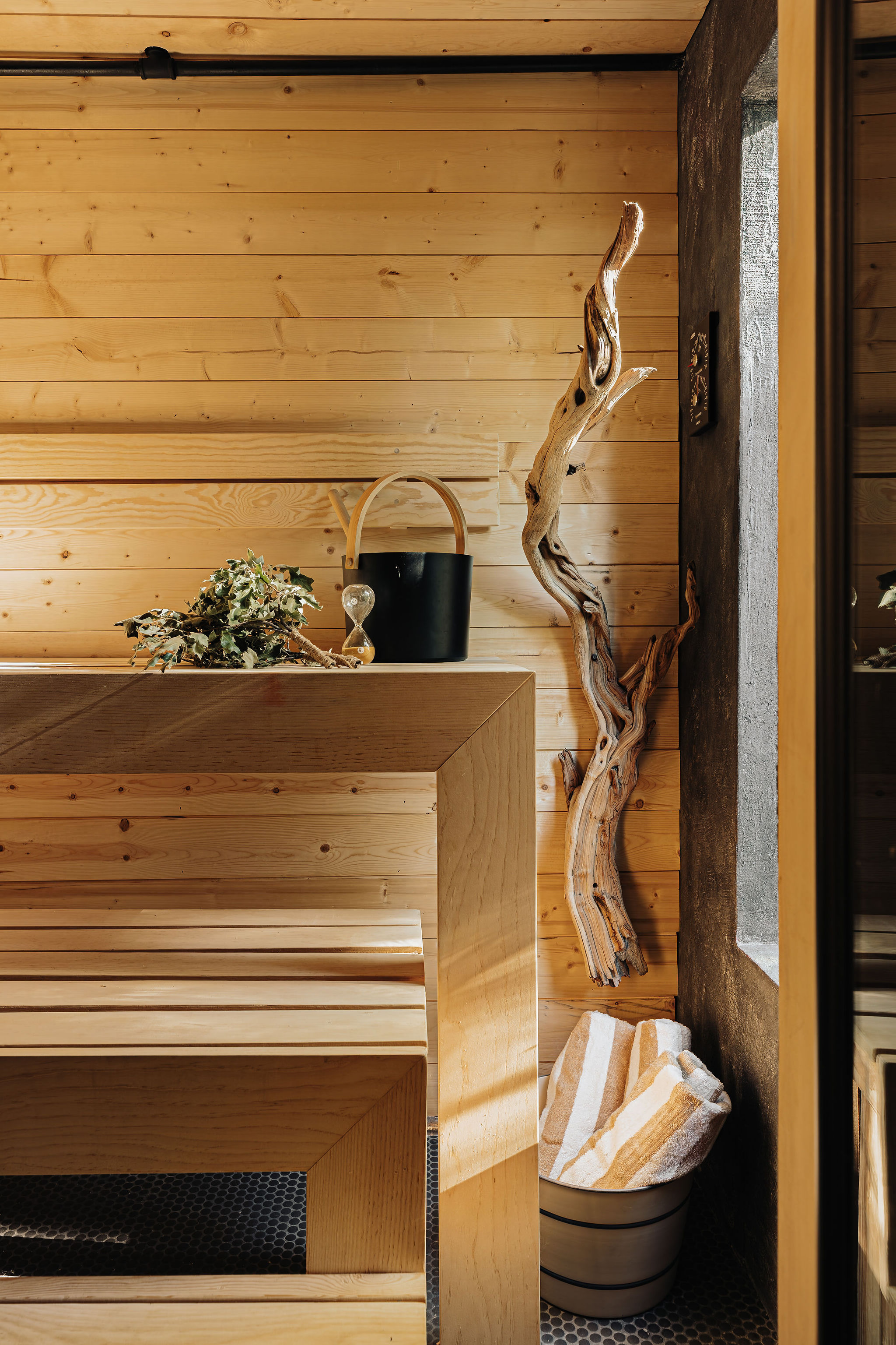Warm wood sauna with rustic spa details and a serene retreat feel