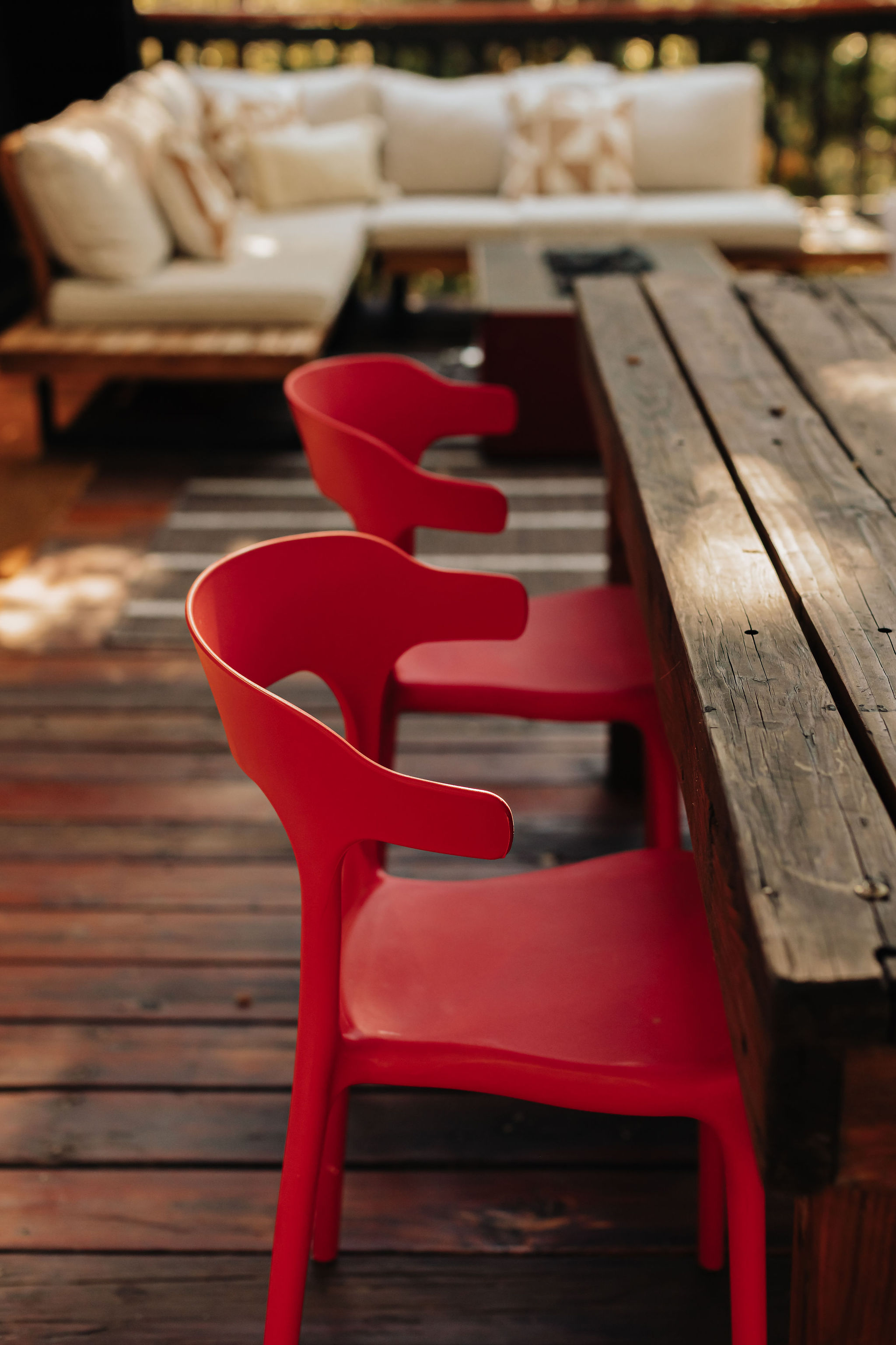 Inviting deck dining with bold seating and a cozy outdoor lounge