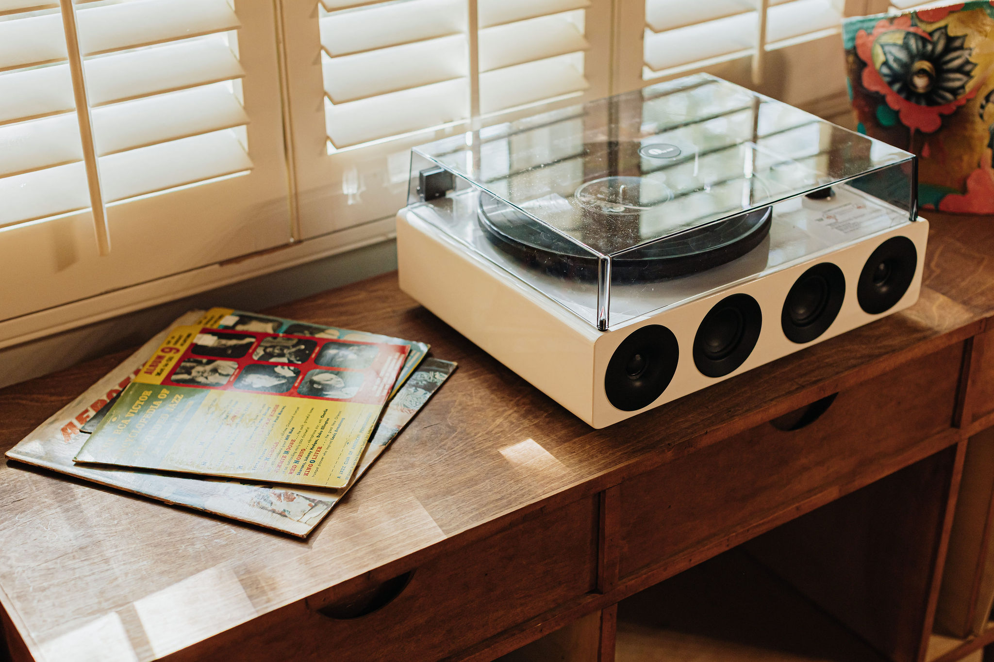 Vintage record player and vinyl setup for a cozy, music-filled stay