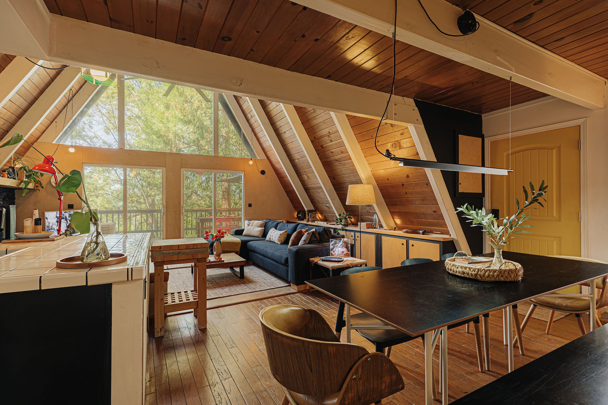 Sunlit A-frame retreat with soaring windows and cozy cabin charm