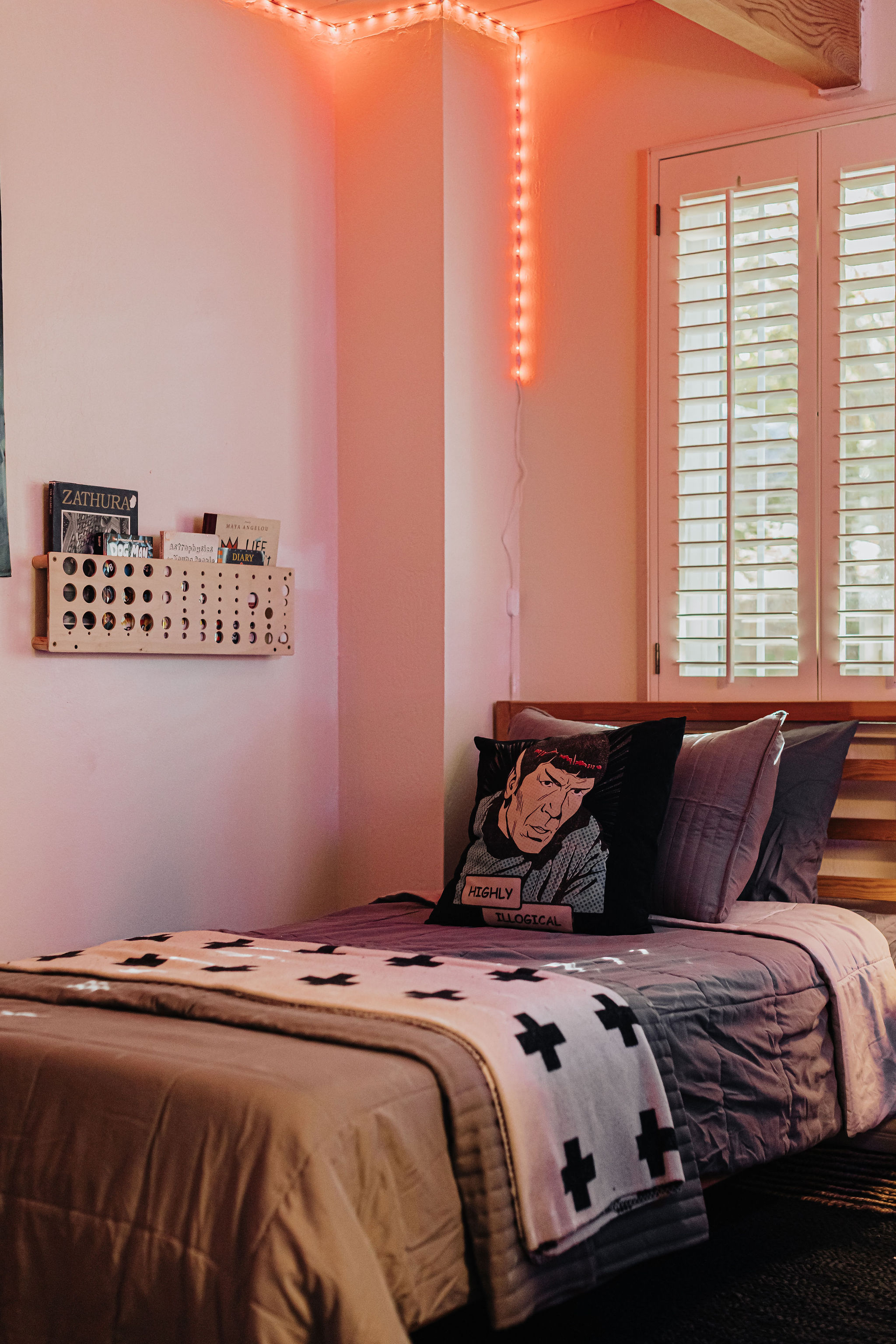 Cozy single bedroom with ambient lighting and stylish modern touches