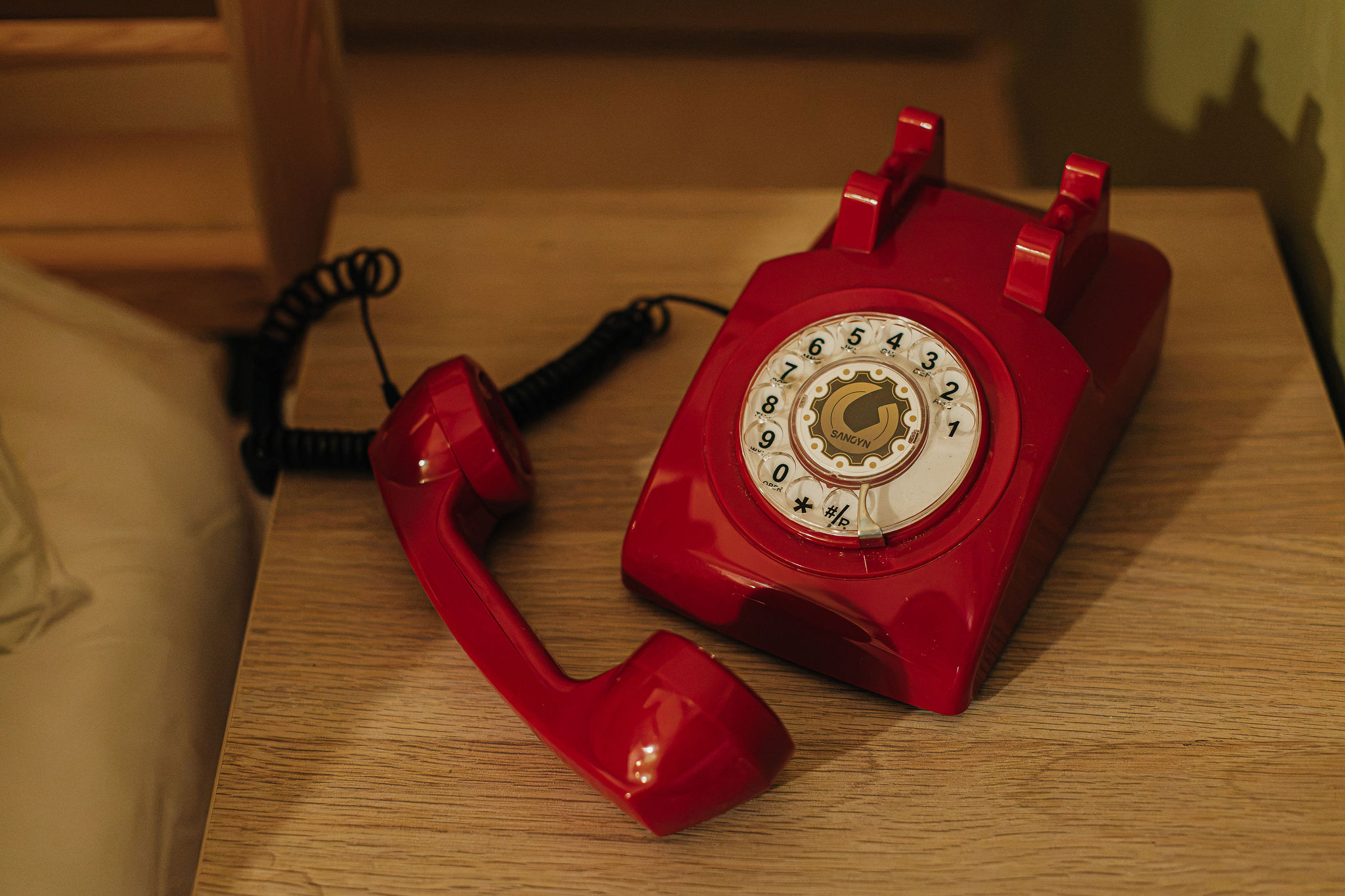 Retro red rotary phone adds a cozy, charming vintage touch