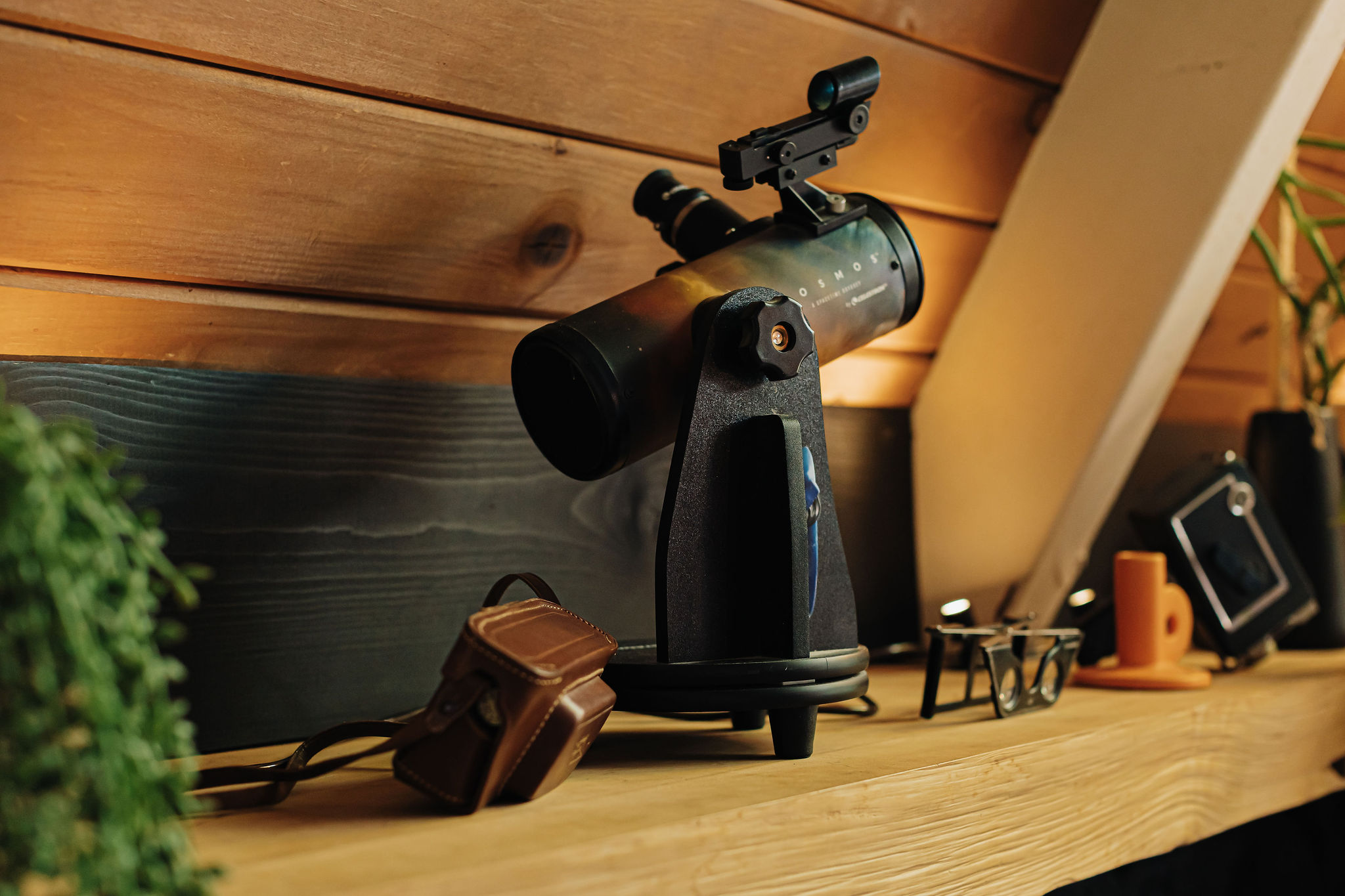 Cozy cabin detail with telescope for memorable stargazing nights
