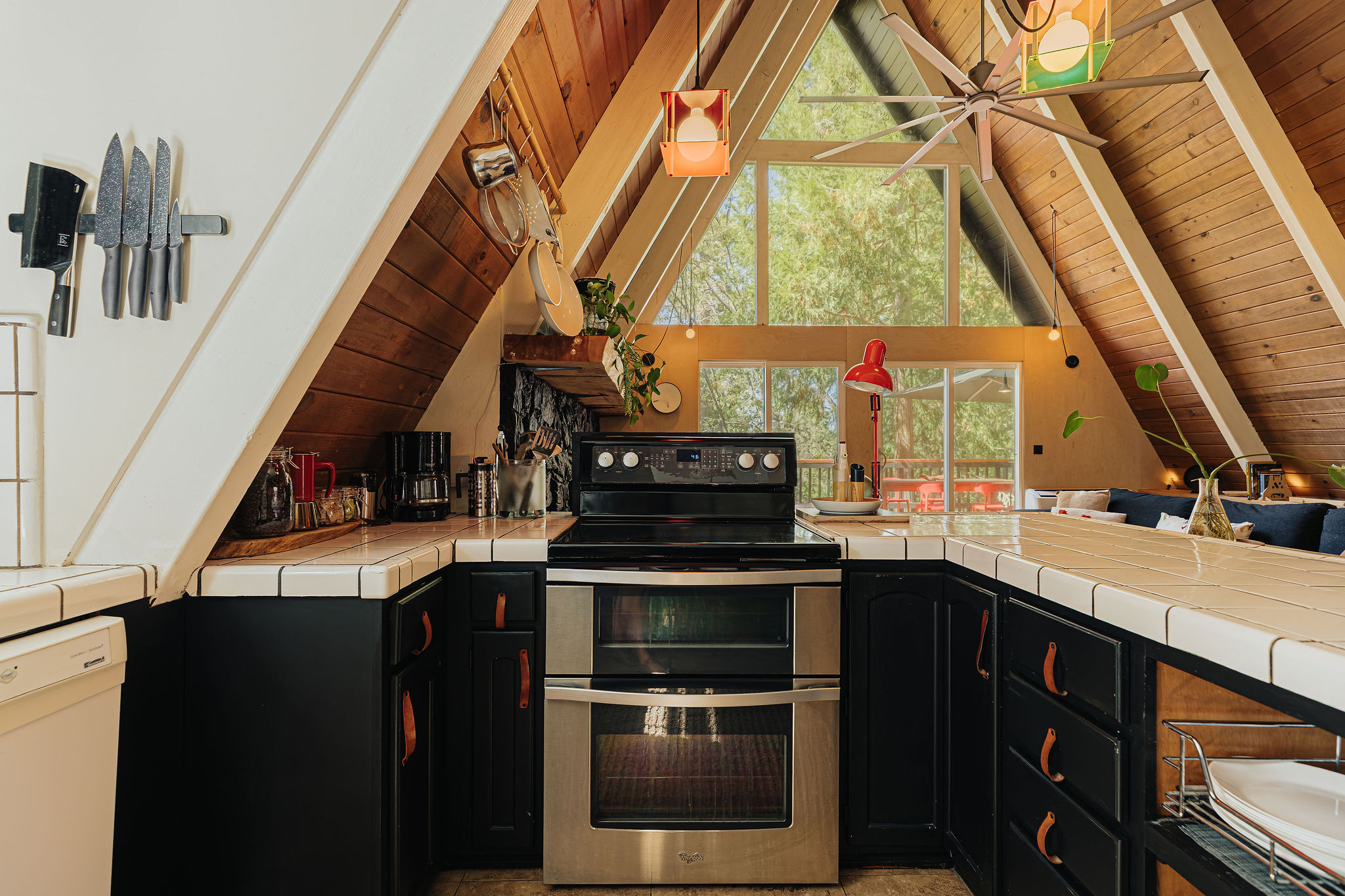 Bright A-frame kitchen with soaring windows and cozy cabin charm