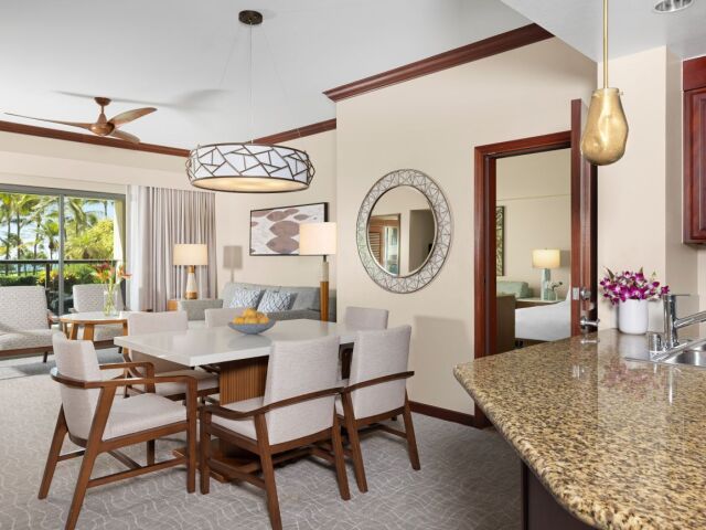 Bright tropical suite with open living, dining, and granite kitchen