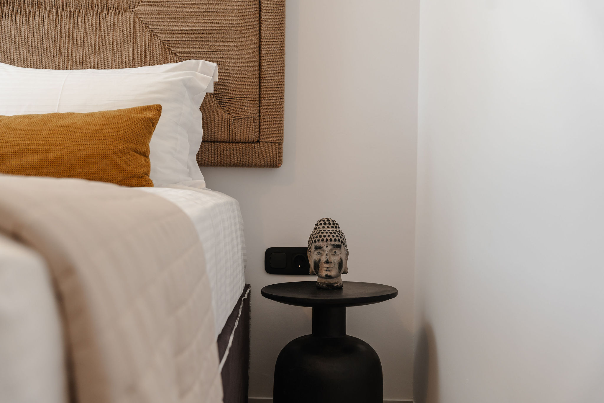 Cozy designer bedroom with luxe linens and stylish modern accents