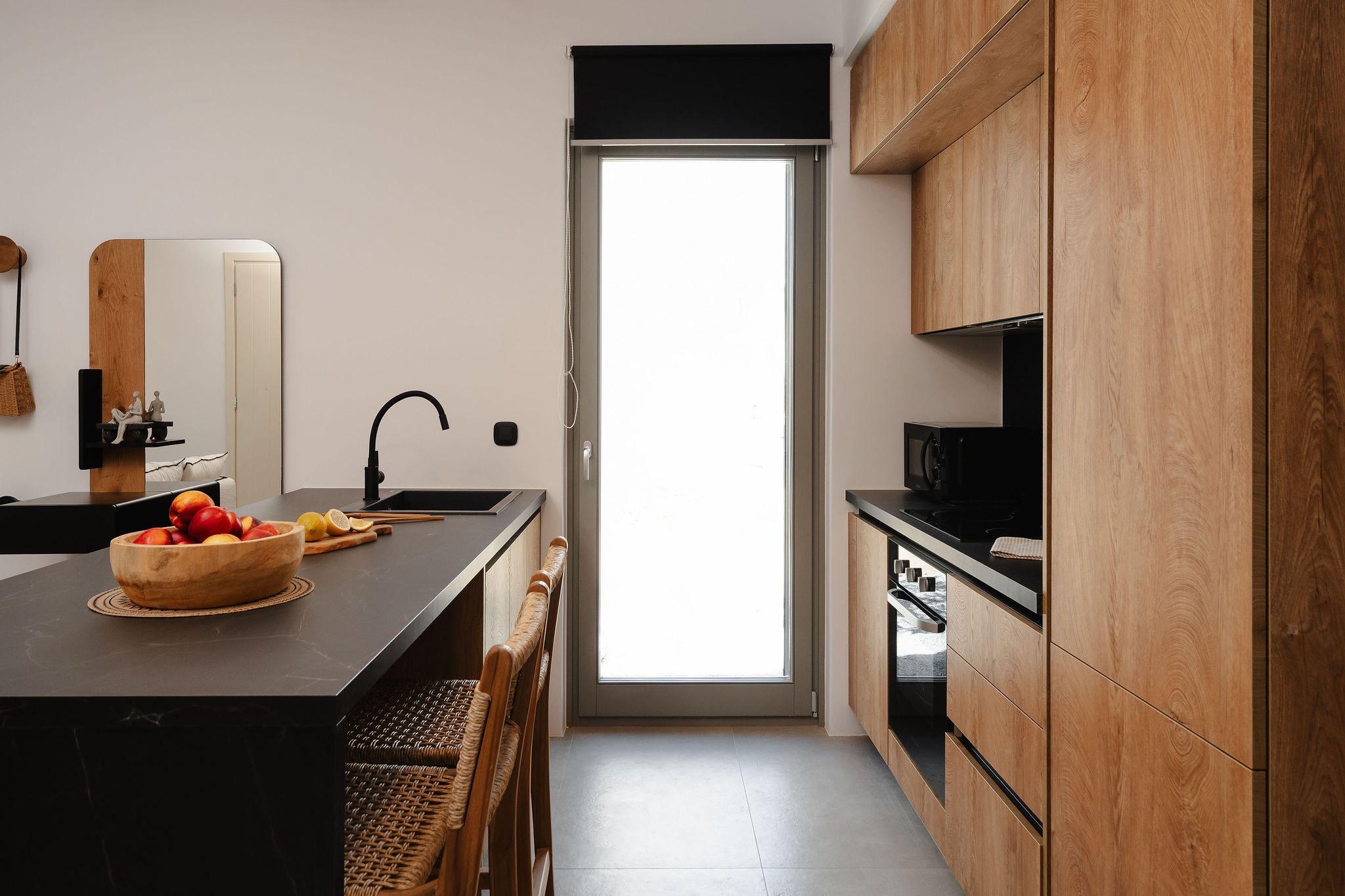 Stylish modern kitchen with bar seating and warm wood finishes