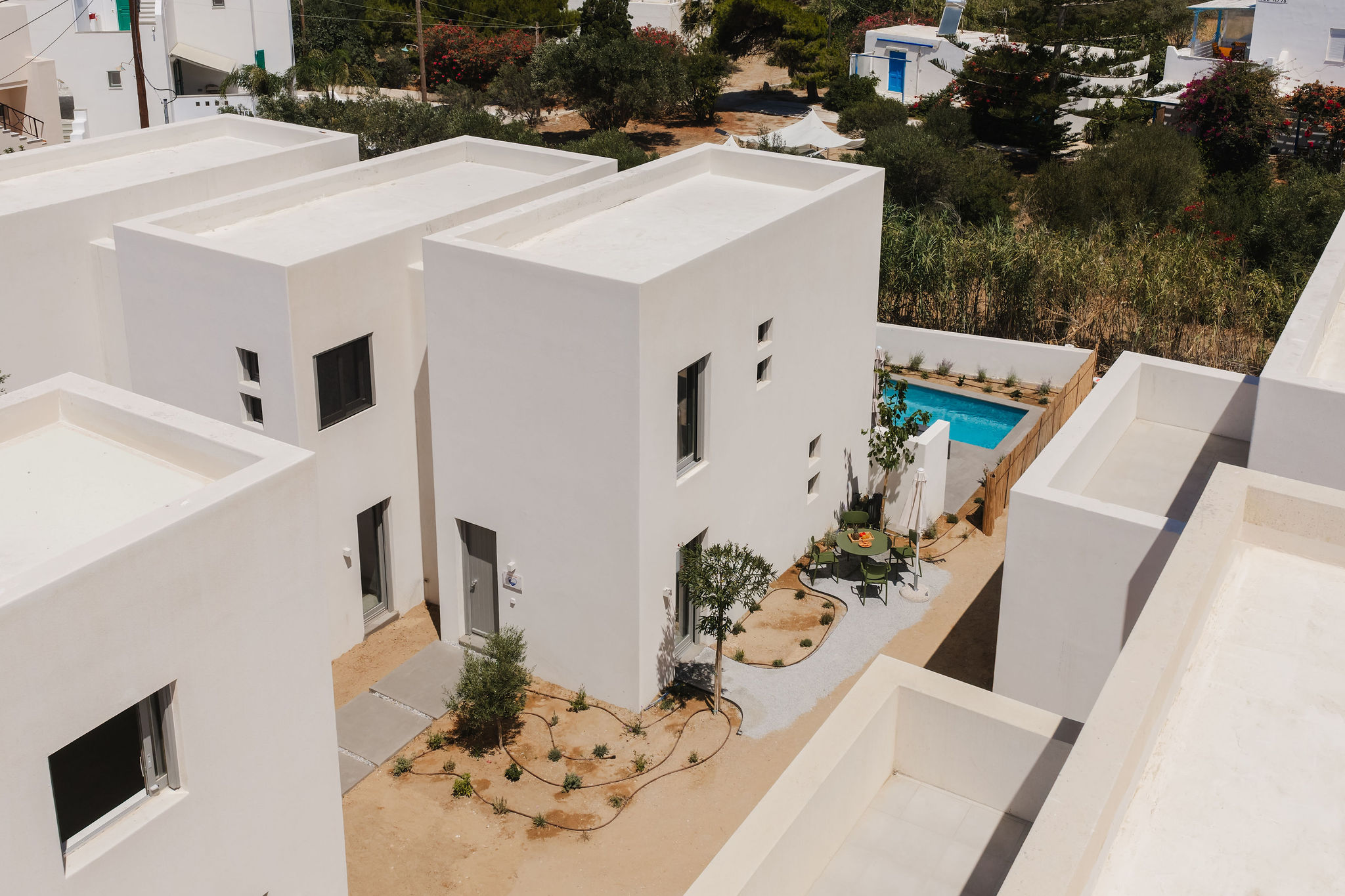 Modern white villa with private plunge pool and serene outdoor patio