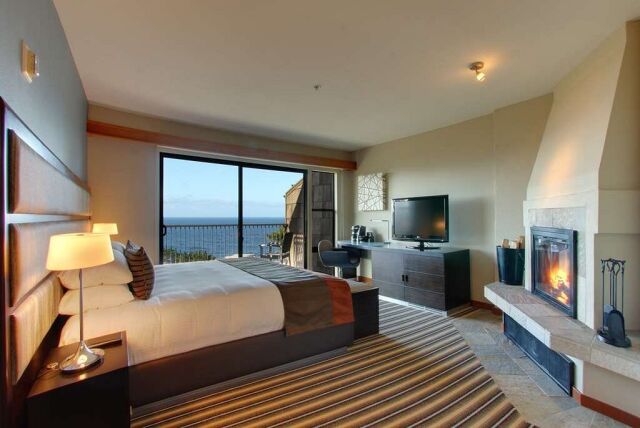 Ocean-view king suite with private balcony and cozy fireplace