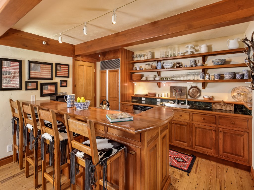 Warm wood kitchen with spacious island seating and rustic charm
